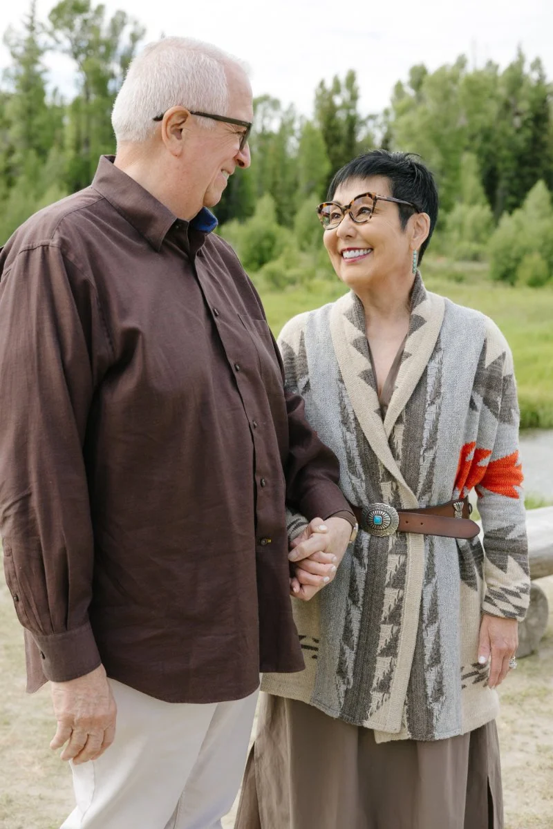  Close-up of a couple holding hands and smiling during a Jackson WY photographer session 