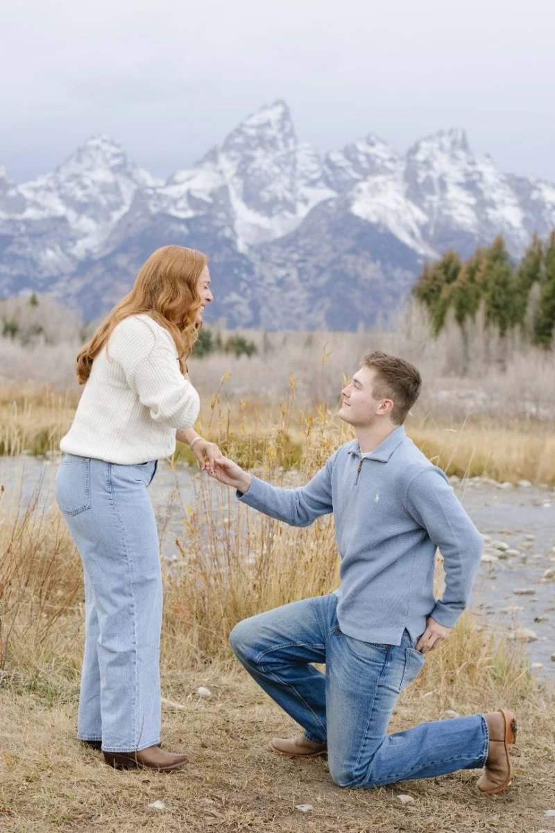  Surprise proposal by the river with mountain backdrop photographed by a Jackson WY photographer 