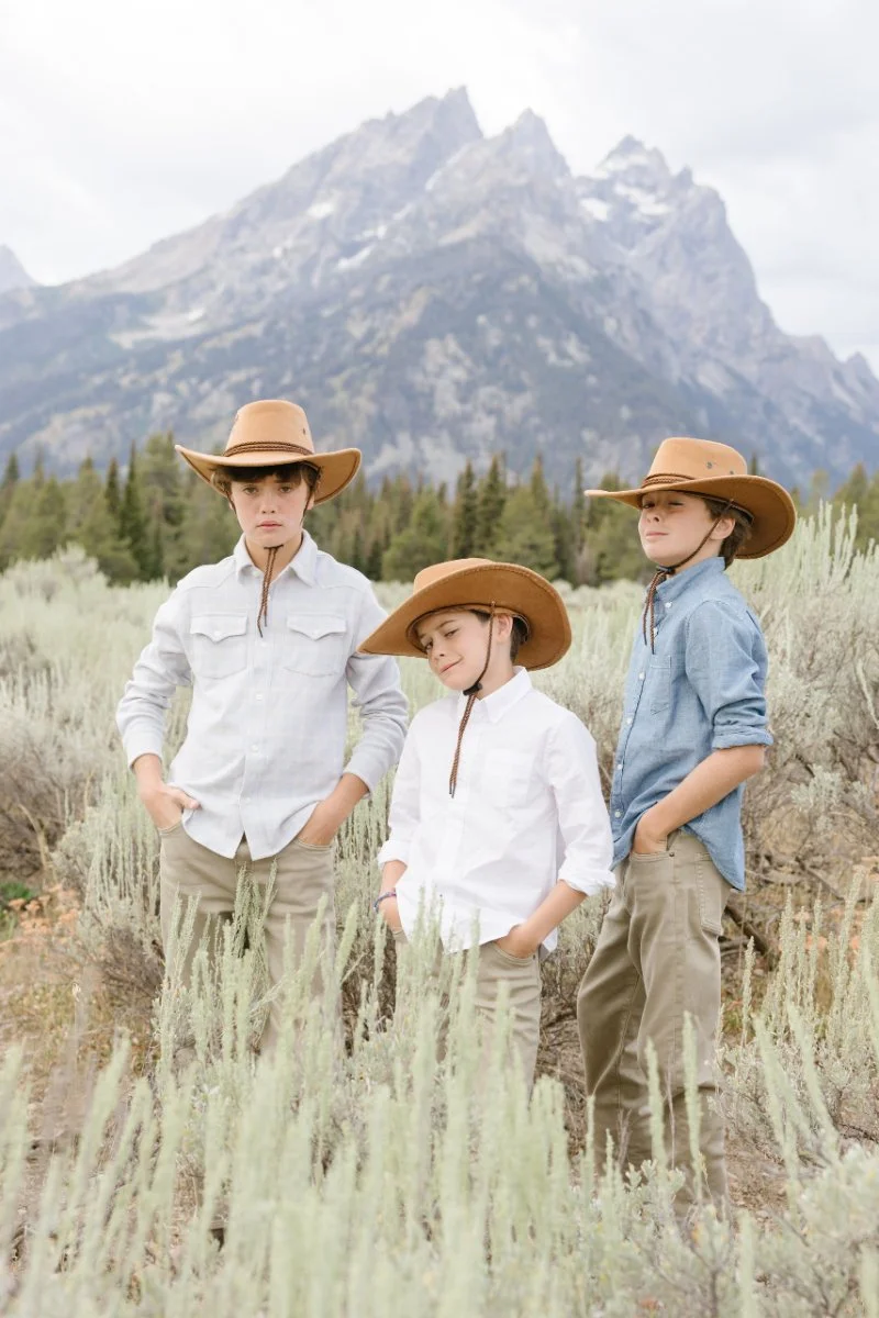  Brothers posing in sagebrush fields during Grand Teton wildflowers season in Jackson Hole 