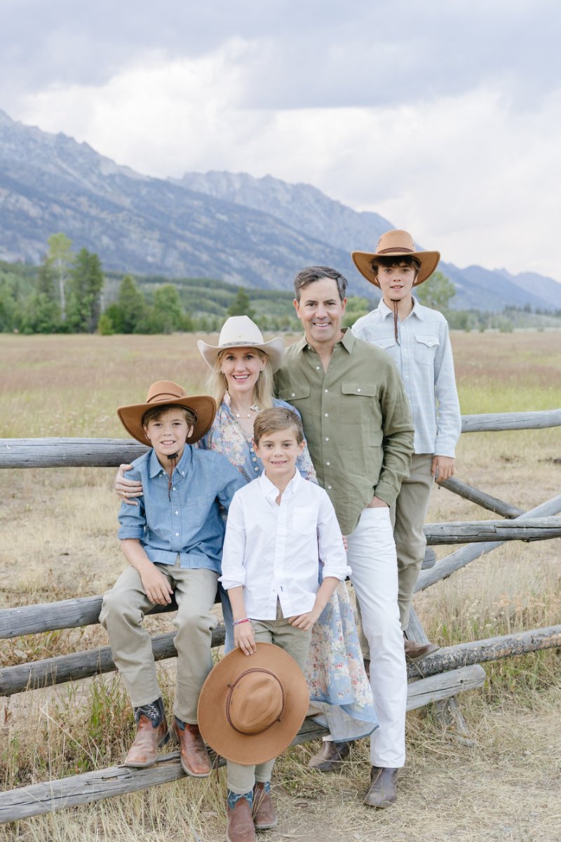  Family portrait at Mormon Row during Grand Teton wildflowers season in Jackson Hole 