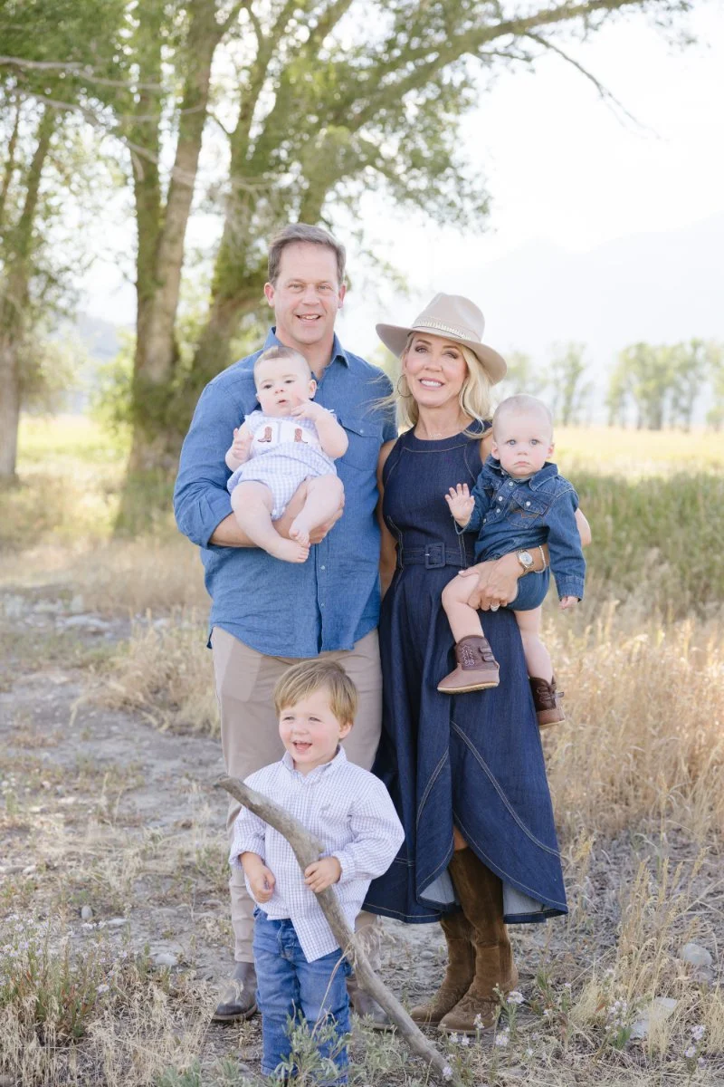  Family traveling with babies during a Grand Teton National Park summer photo session with toddlers and mountain views. 