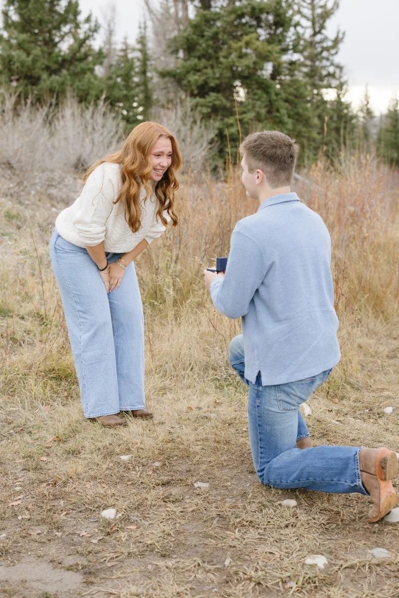  Surprised bride-to-be reacting to a Grand Teton proposal in Grand Teton National Park 