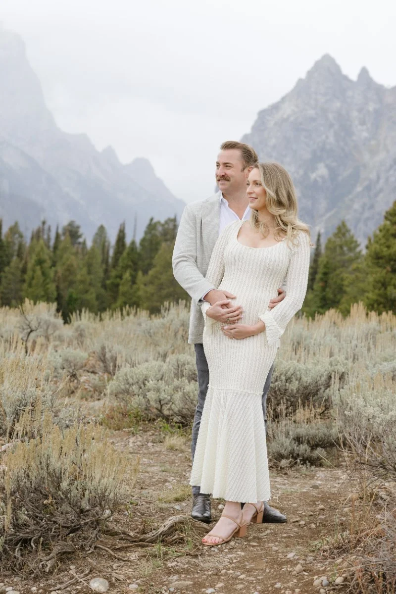  Expecting parents enjoying a maternity session with Teton mountain views in Jackson Hole 