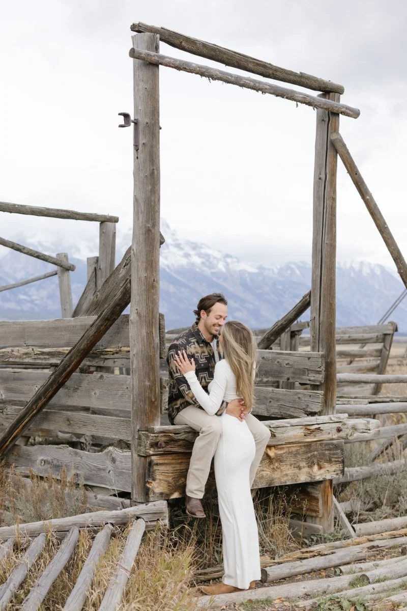  Couple showing what to wear for a proposal photoshoot in Jackson Hole with coordinated neutral outfits 