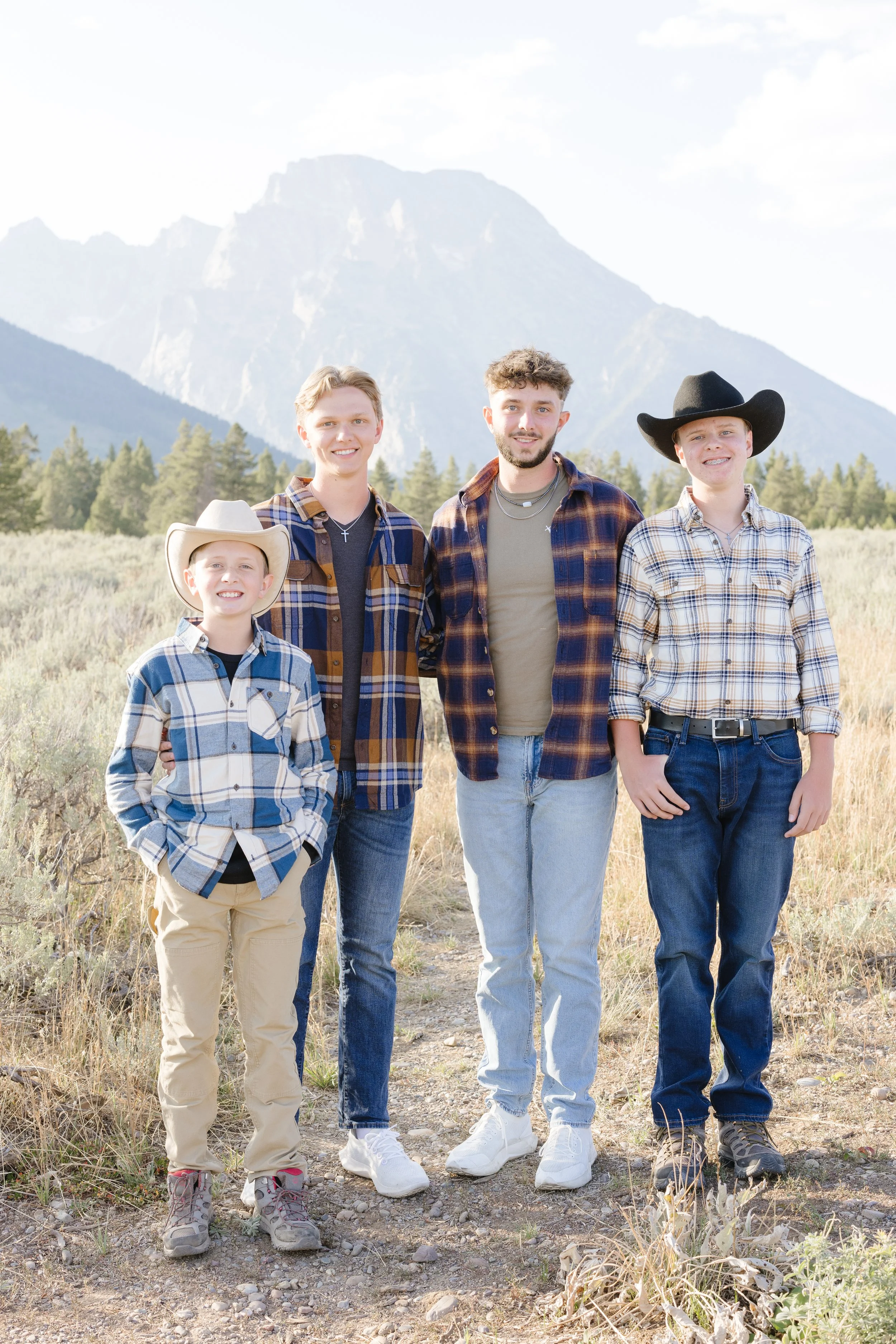 four brothers during a mountainous photo shoot - What to Do with Hundreds of Family Photos