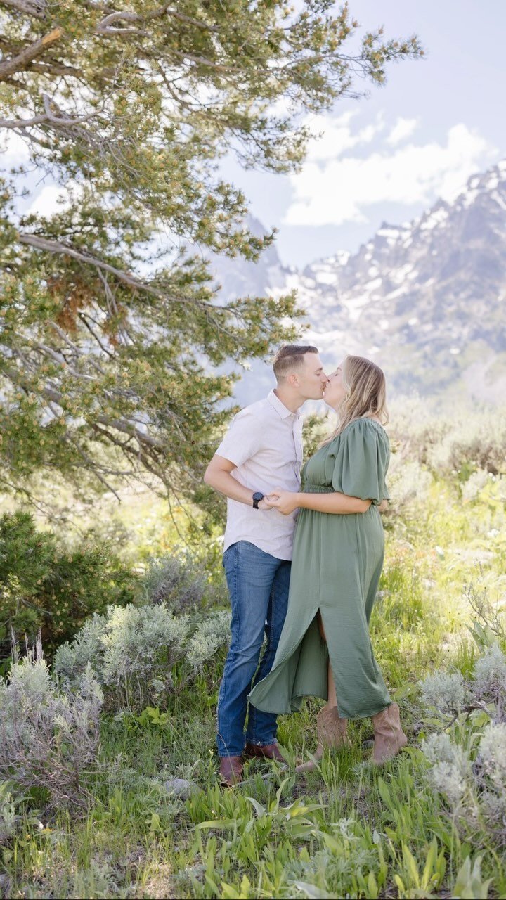 a couple kissing with alpine views during their couple photo session
