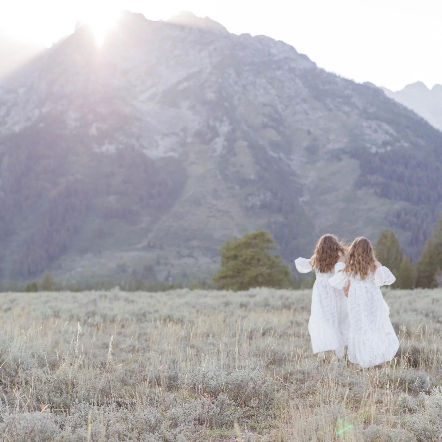 two girls running through the field - Why Photography Matters