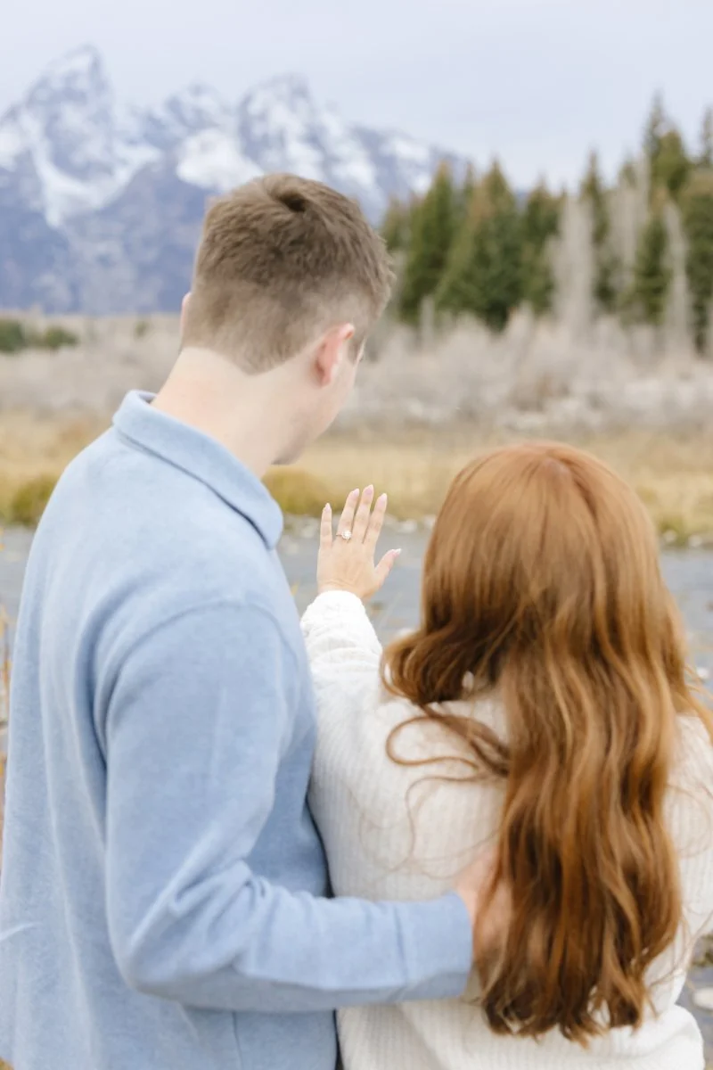 What to wear for a proposal photoshoot featuring neutral sweaters and denim in Jackson Hole