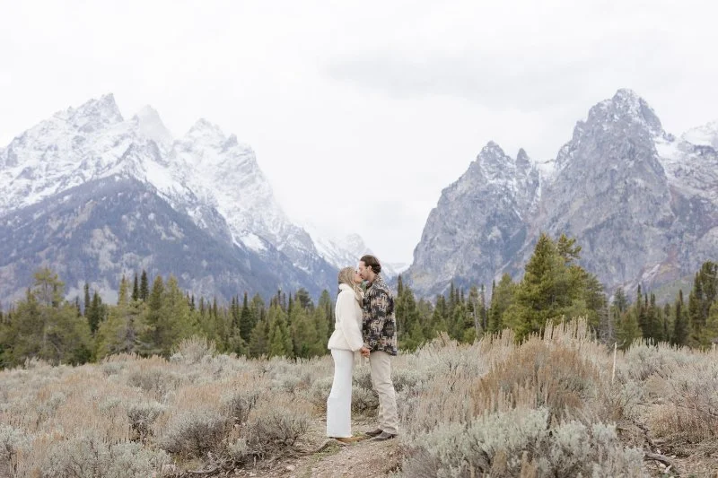What to wear for a proposal photoshoot in Jackson Hole with neutral outfits and Grand Teton mountain views