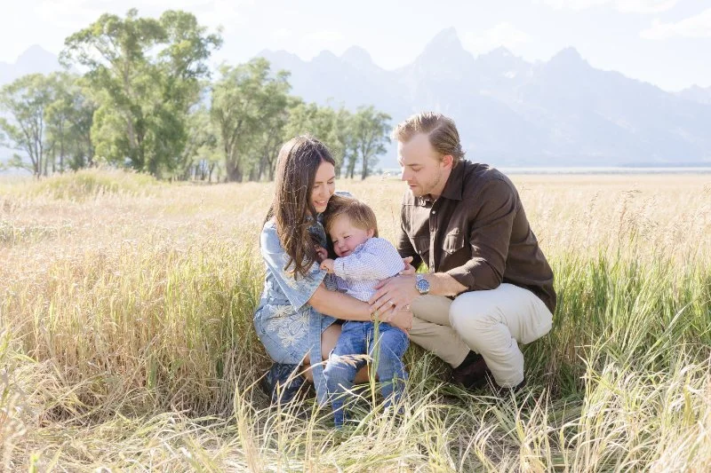 Family traveling with babies in Grand Teton National Park during a relaxed summer family photo session in the mountains.