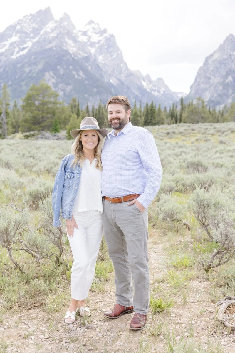 Couple stand for photograph at the legendary going-to-the-sun Road Montana