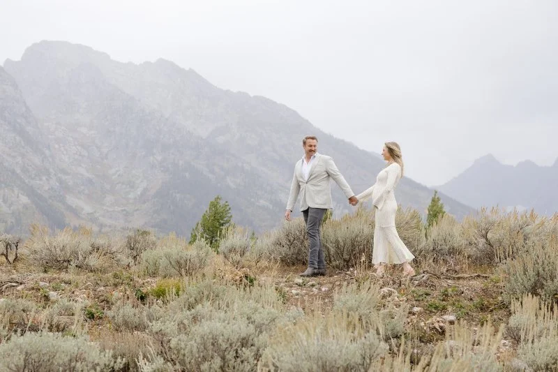 Pregnancy photo announcement session in Jackson Hole with mountain views and expecting couple