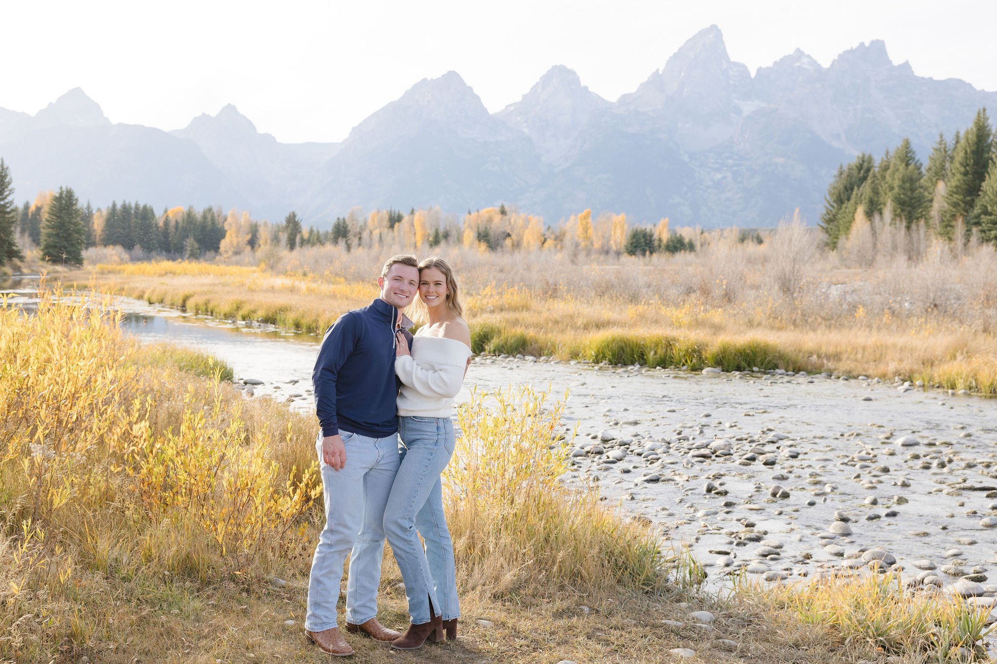 Jackson Hole proposal photographer captures couple after a surprise engagement at Schwabacher Landing.