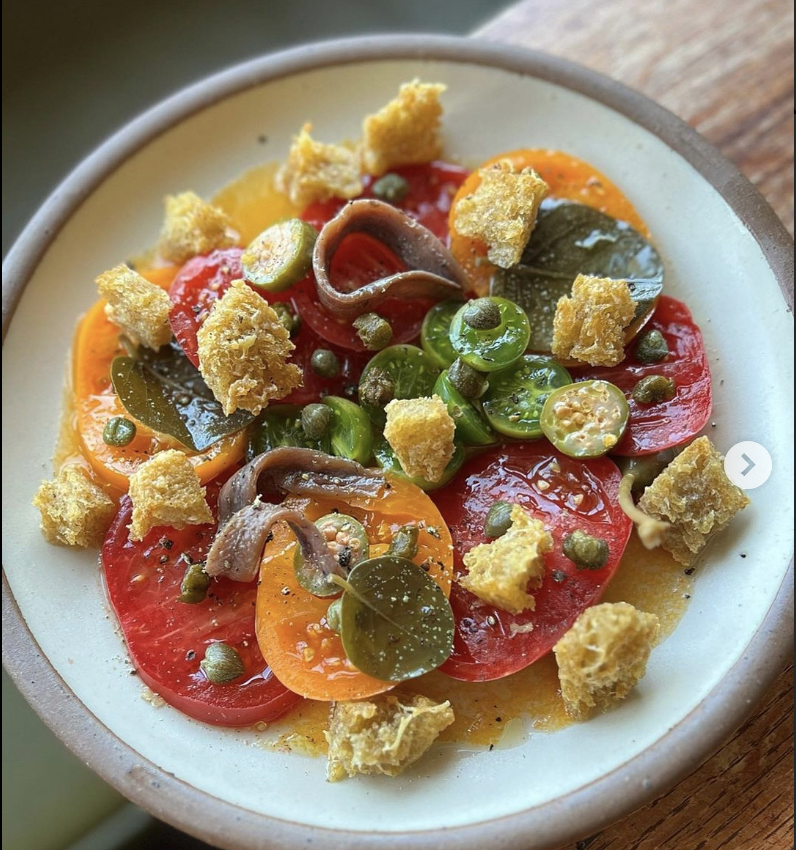 tomato, crumbs, anchovies, herb oil.png