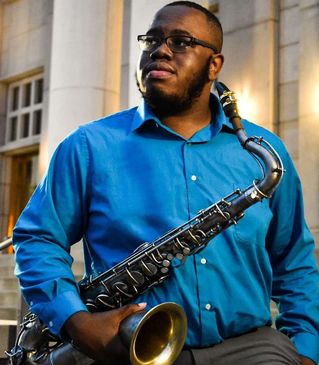 Man holding a saxophone