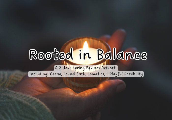 hand holding a candle sign says rooted in balance