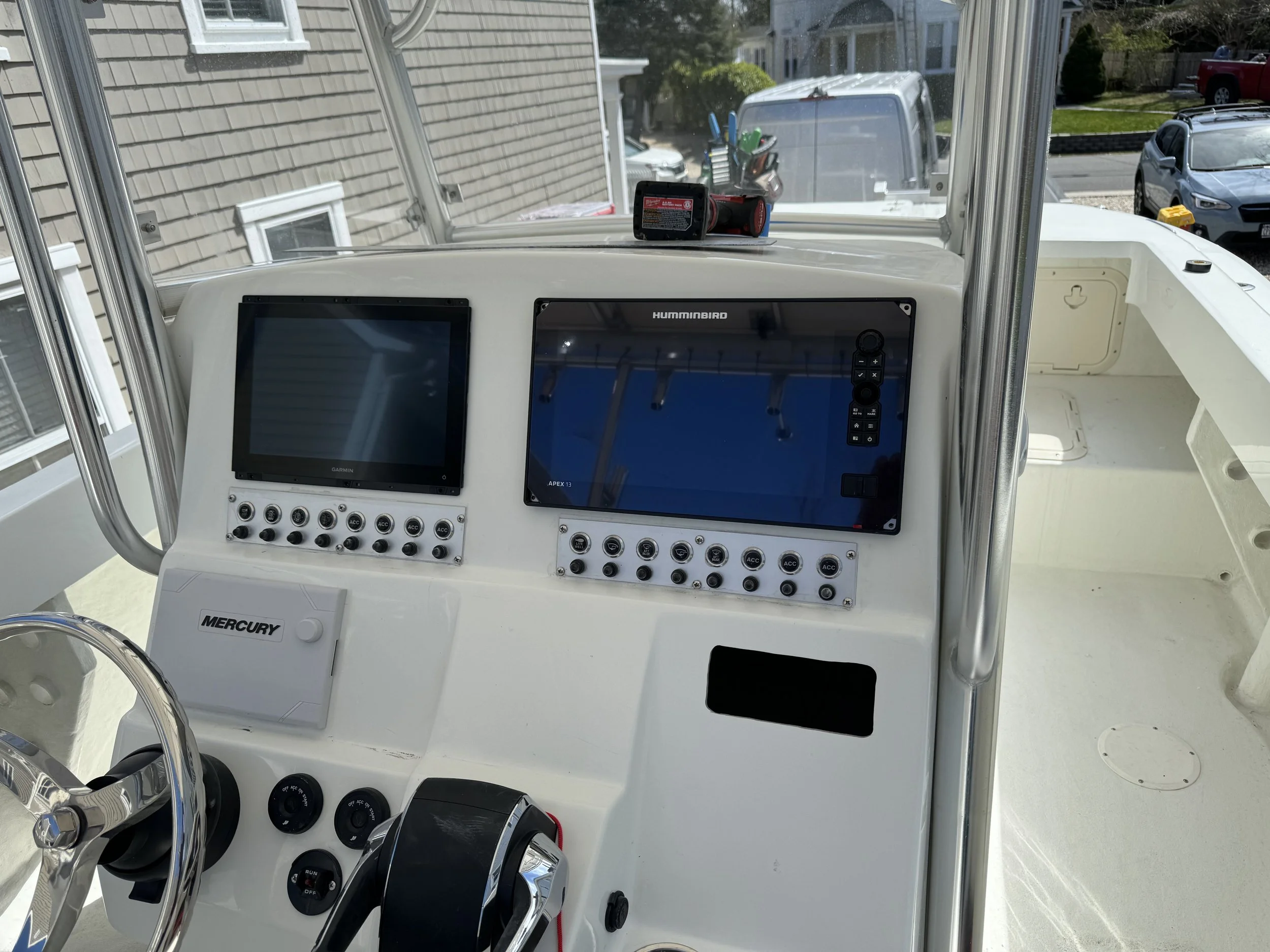 huminbird and garmin screen on a 24 cat center console