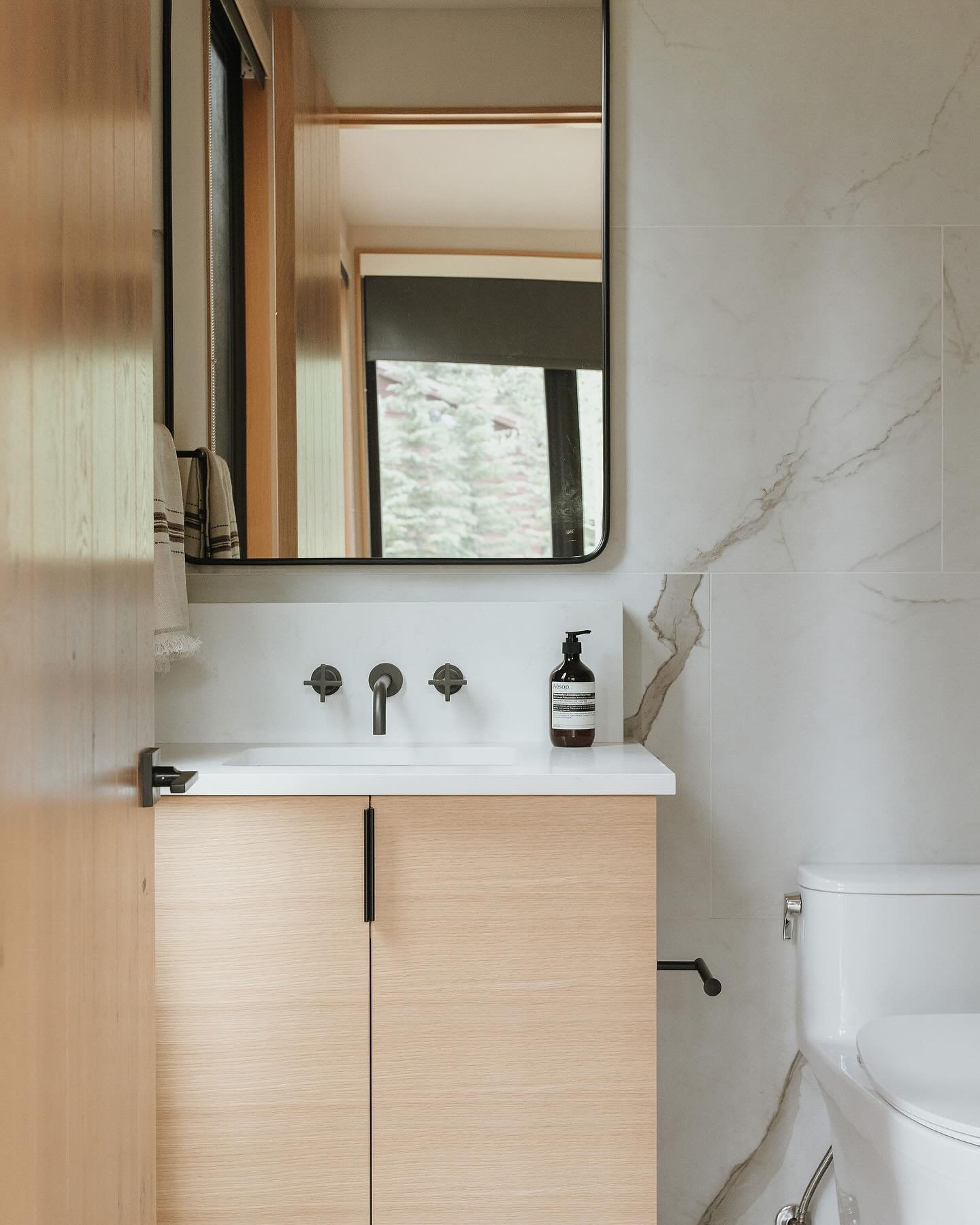 A glimpse into the bathrooms from the mountain retreat I designed for a favorite client, where a shared design language creates a sense of harmony while distinct material choices give each space its own personality. The continuity comes through in th