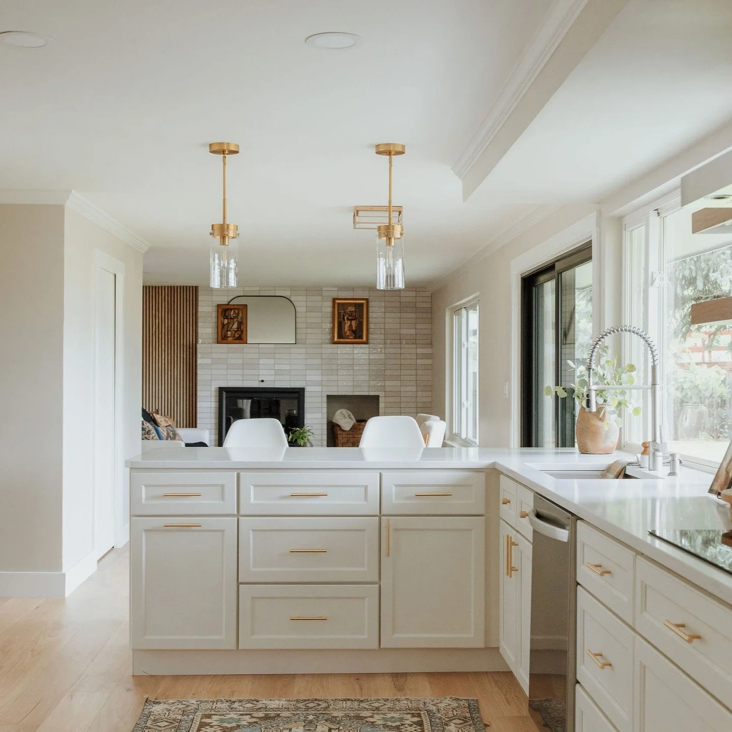 There&rsquo;s something especially calming about a kitchen that doesn&rsquo;t try too hard. This one balances serene tones with thoughtful details&mdash;brass fixtures that catch the light just enough, floating wood shelves that soften the walls, and