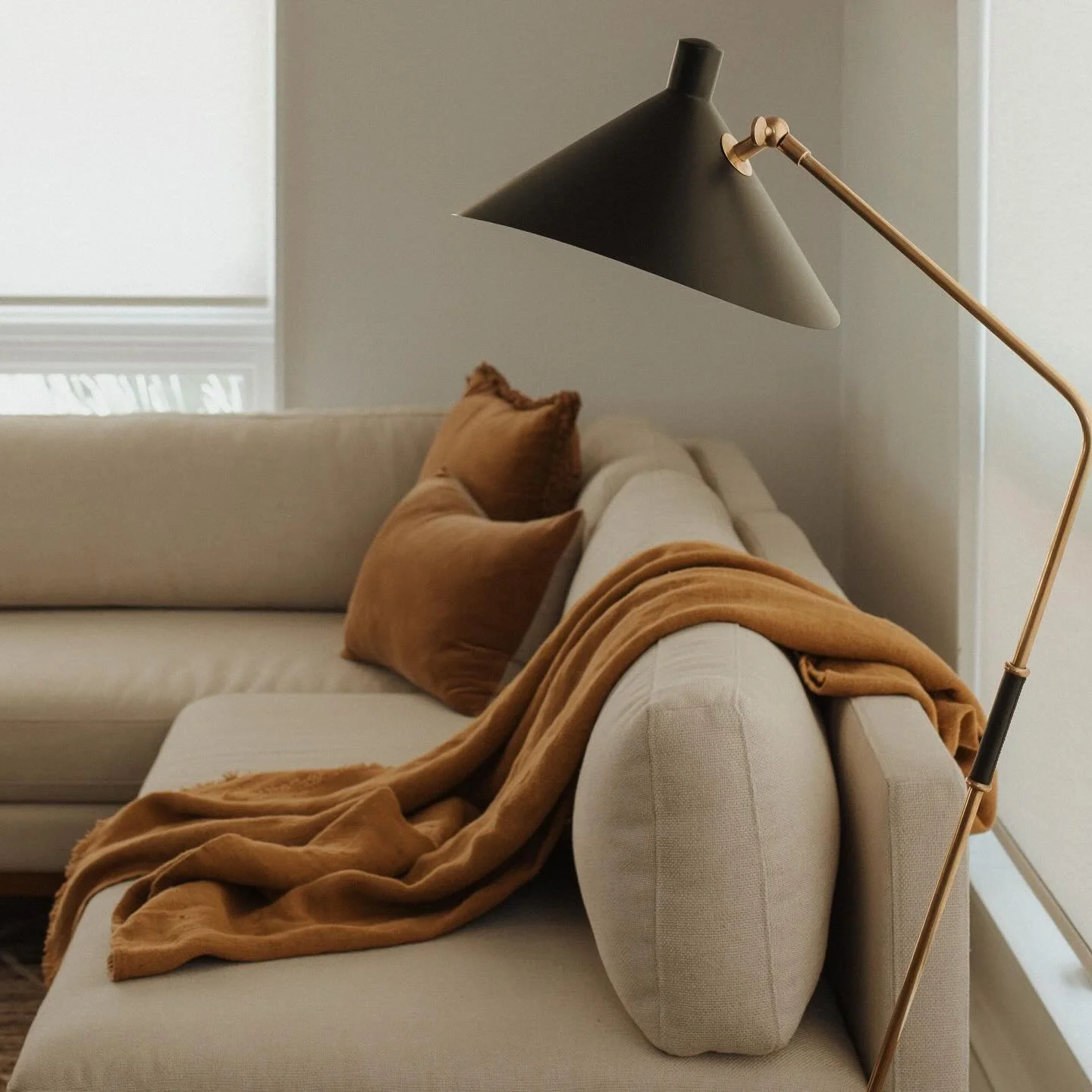 When the lighting just pops. A neutral background can still have depth and contrast when layered with rich tones through lighting and soft goods.&thinsp;
&thinsp;
The palette stays calm, but the warm fixtures and soft textures add a quiet richness th