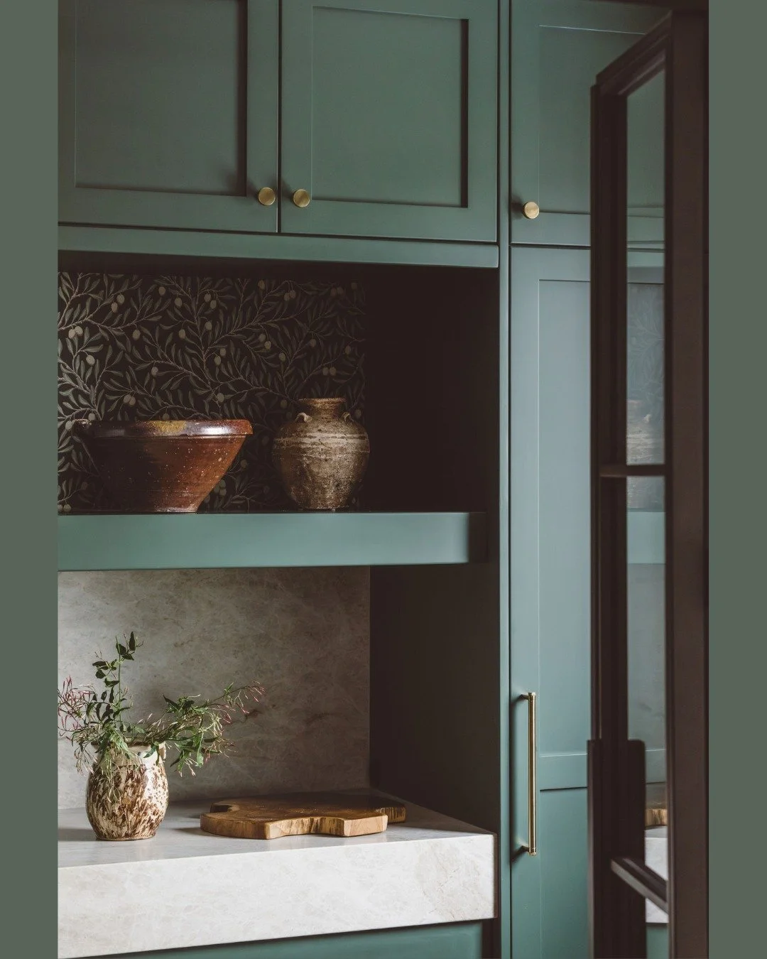 This pantry was such a dream to design. The client trusted the vision and fully embraced the rich green cabinetry, and gave me the freedom to bring in a bit of whimsy with the wallpaper detail.

What you don&rsquo;t see here is that the wallpaper con