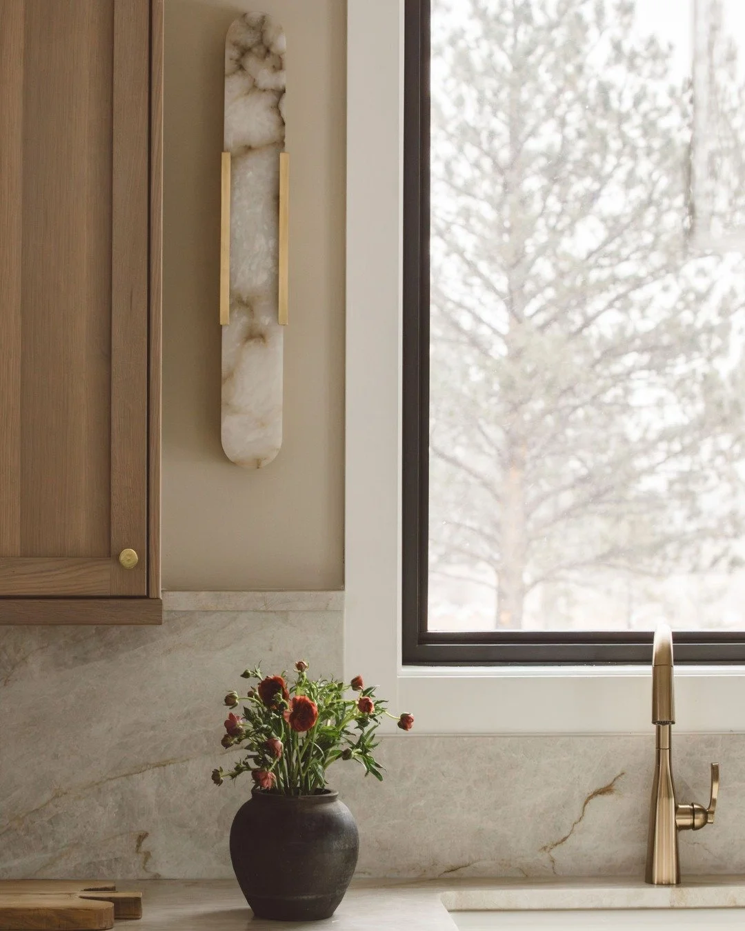 When the design just works. 

We let the natural materials shine for this project. Leaning into the classic Taj Mahal quartzite, notice that charming little edge to complete the backsplash. Rift cut white oak cabinets, alabaster sconces, brass fixtur