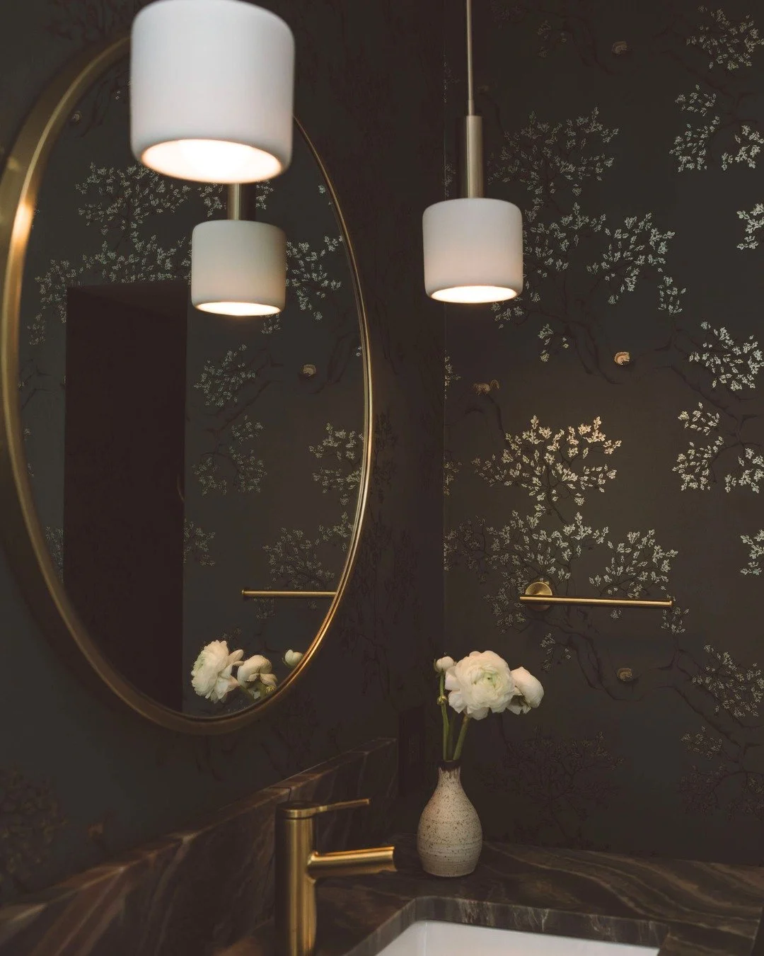 When the powder room pops. We went a bit more "all out" with the custom vanity and wallpaper and then kept is lower cost/simple with a CB2 mirror and West Elm pendants.