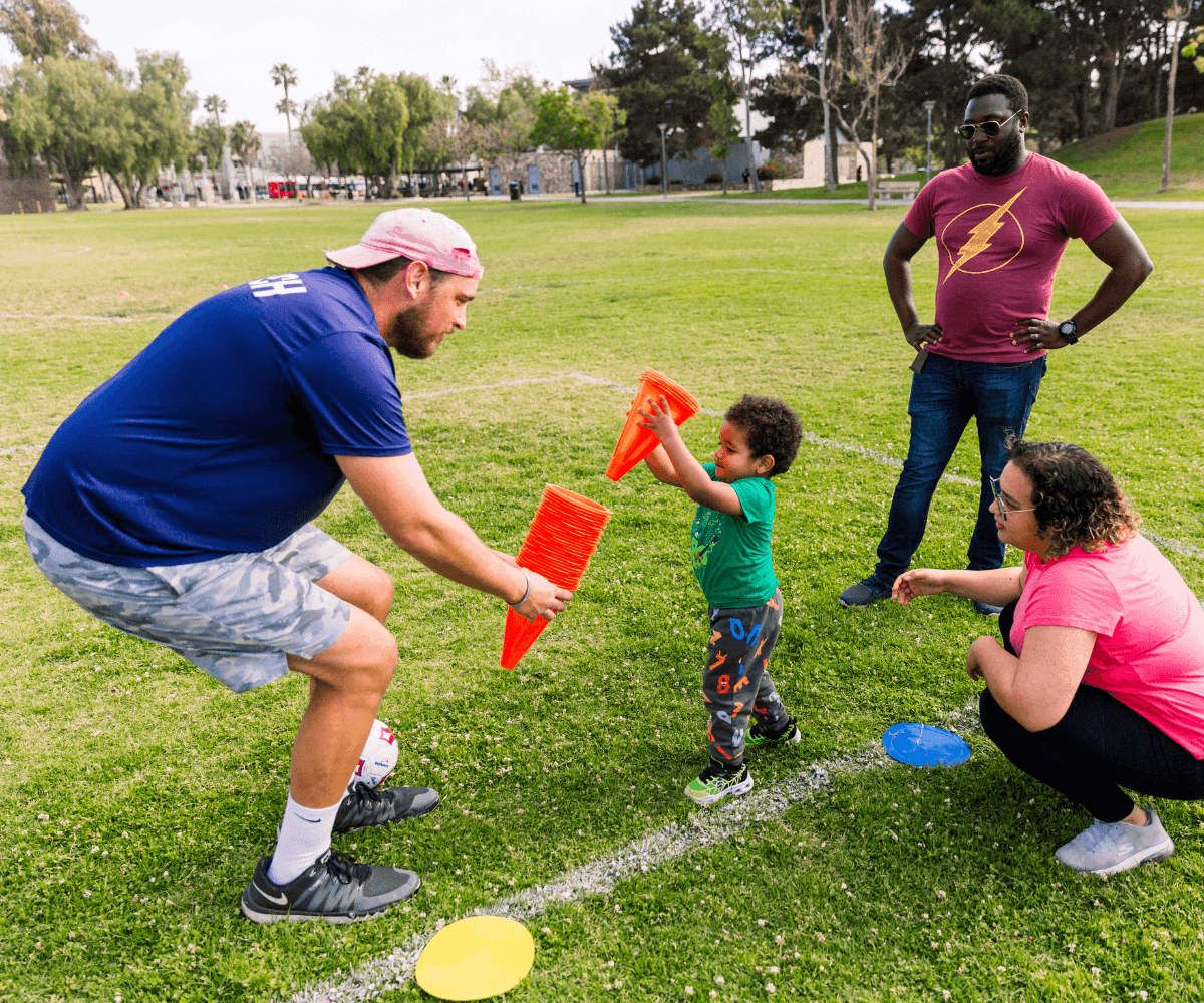 Young child participating in a SuperTots sports class
