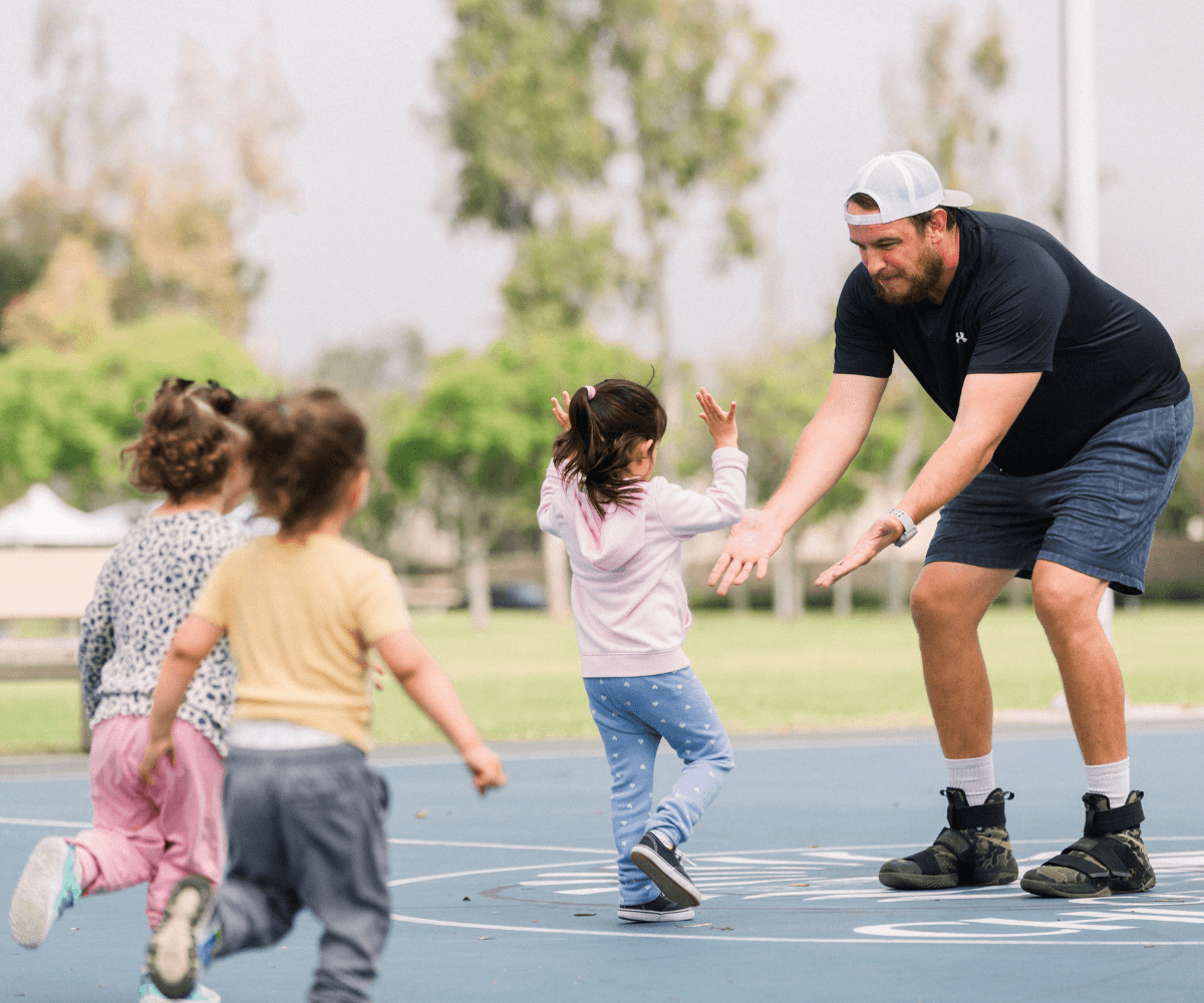 SuperTots coach working with young children