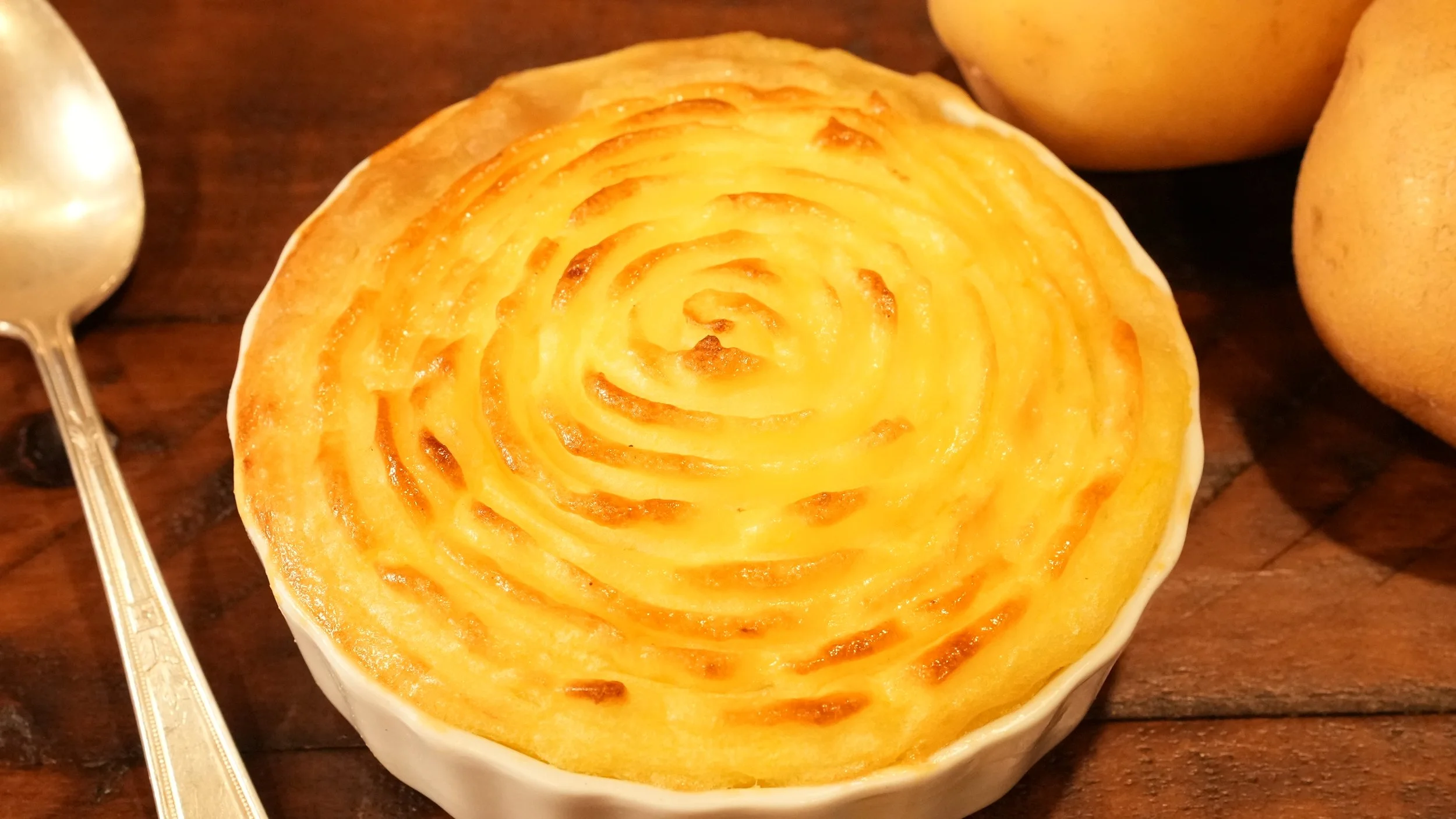 browned mashed potatoes covering minced meat filling