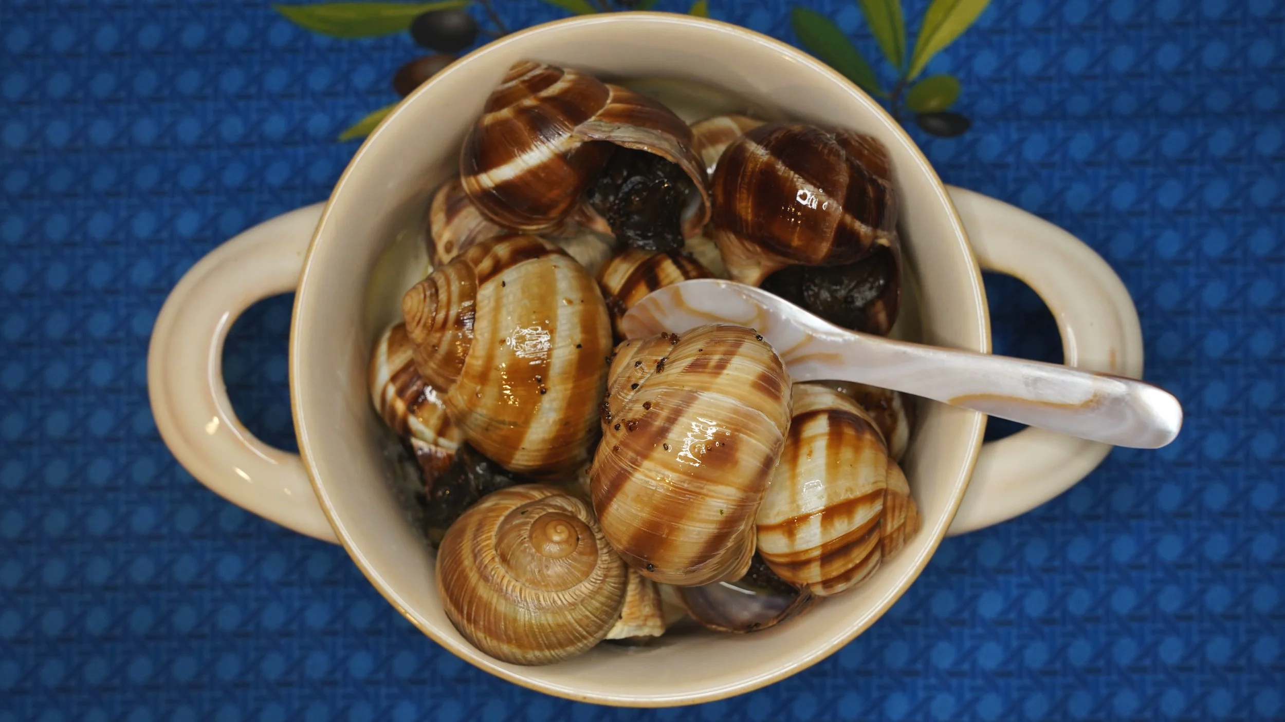 snails sauteed in garum and asafoetida served in their shells