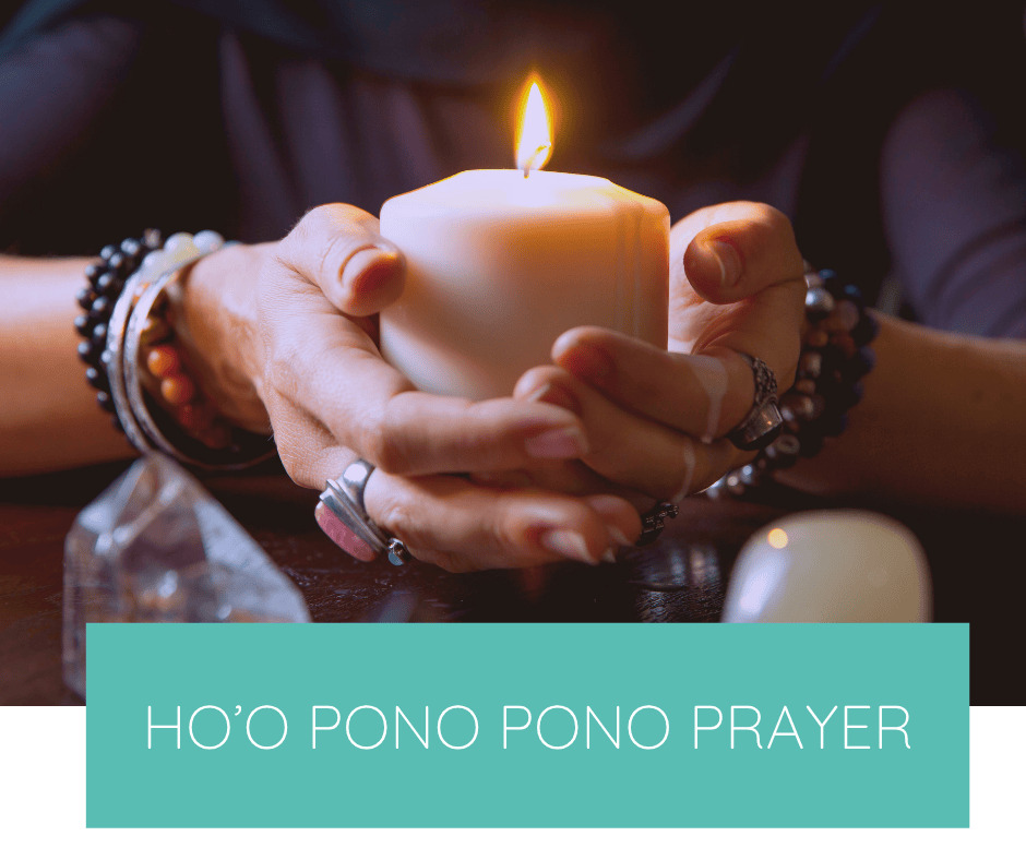 Woman holding a lit candle in prayer
