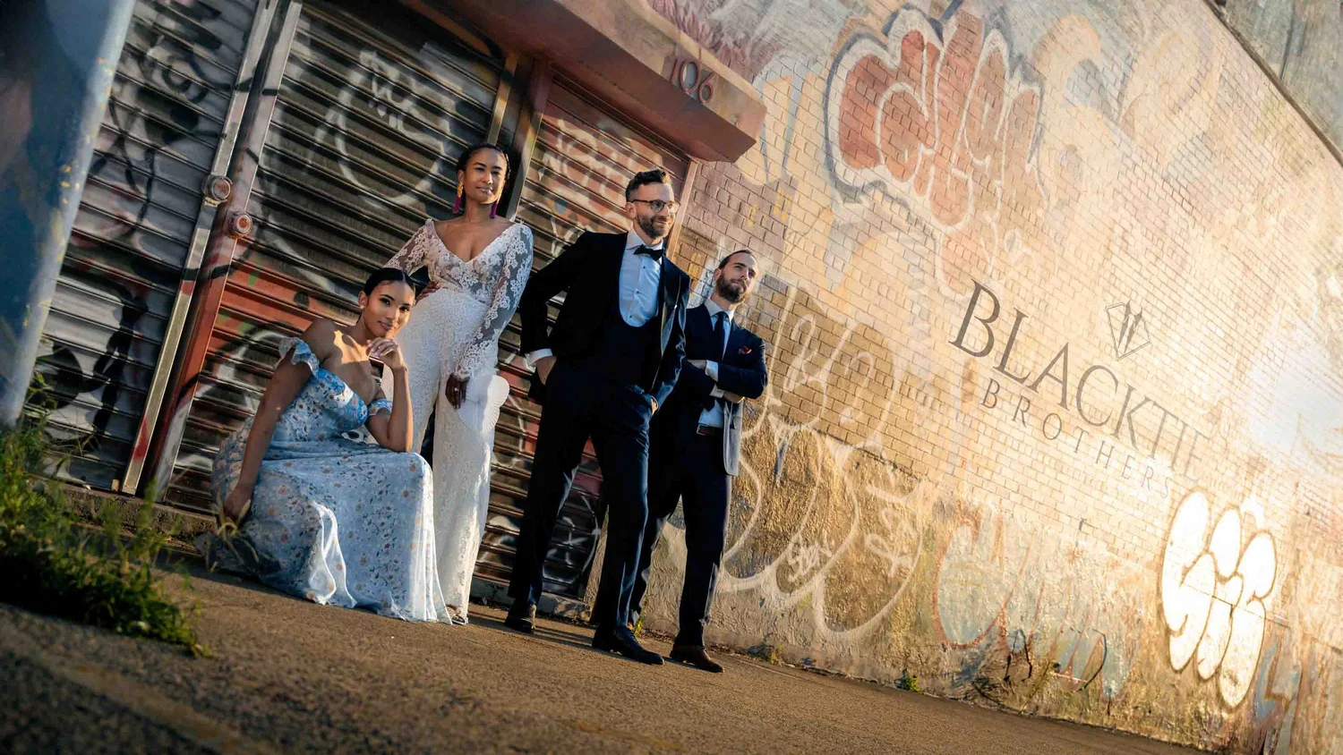 Ciara and Drew with their wedding party in an editorial Brooklyn portrait