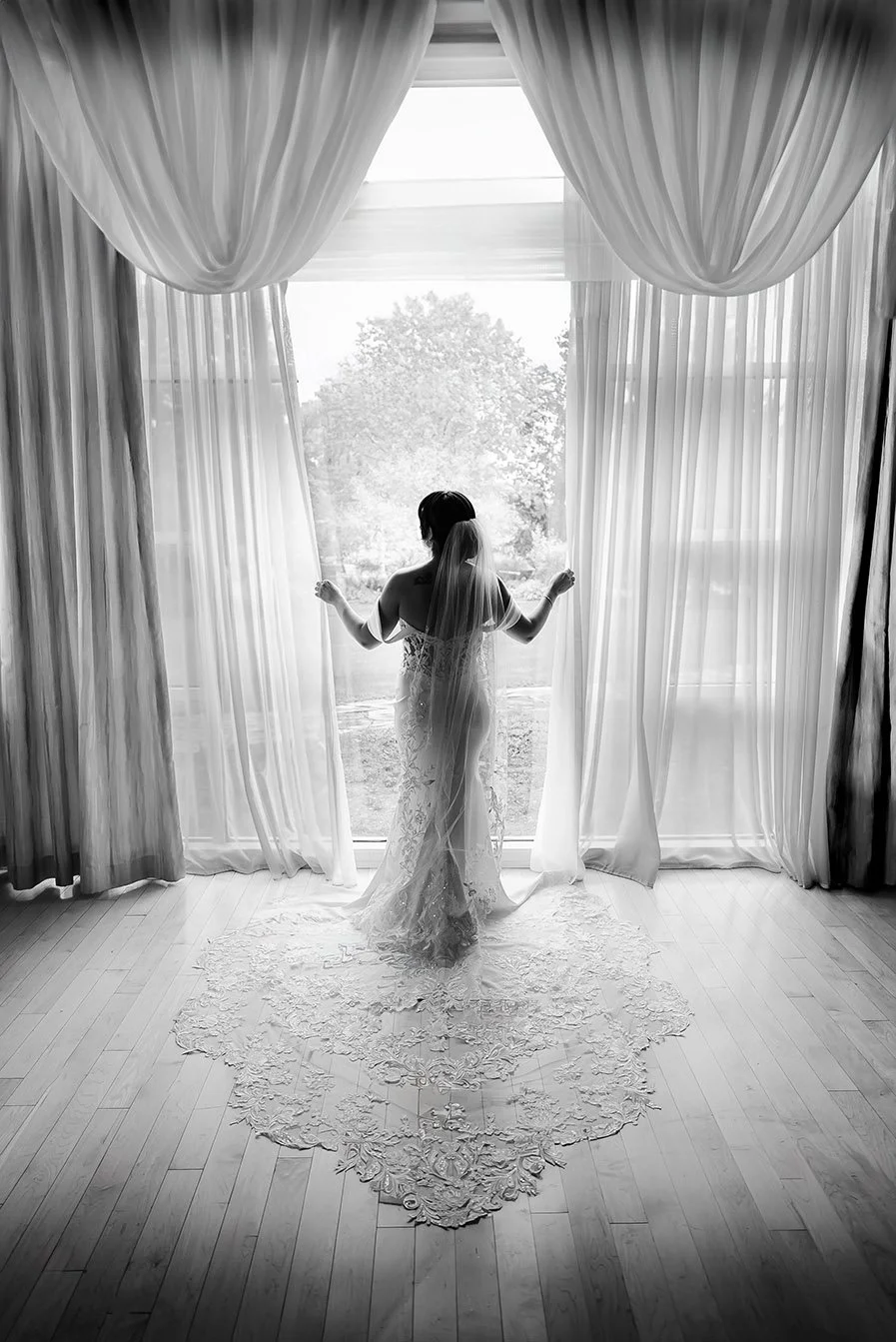 Black-and-white bridal portrait at Turning Stone Resort Casino by BlackTie Brothers