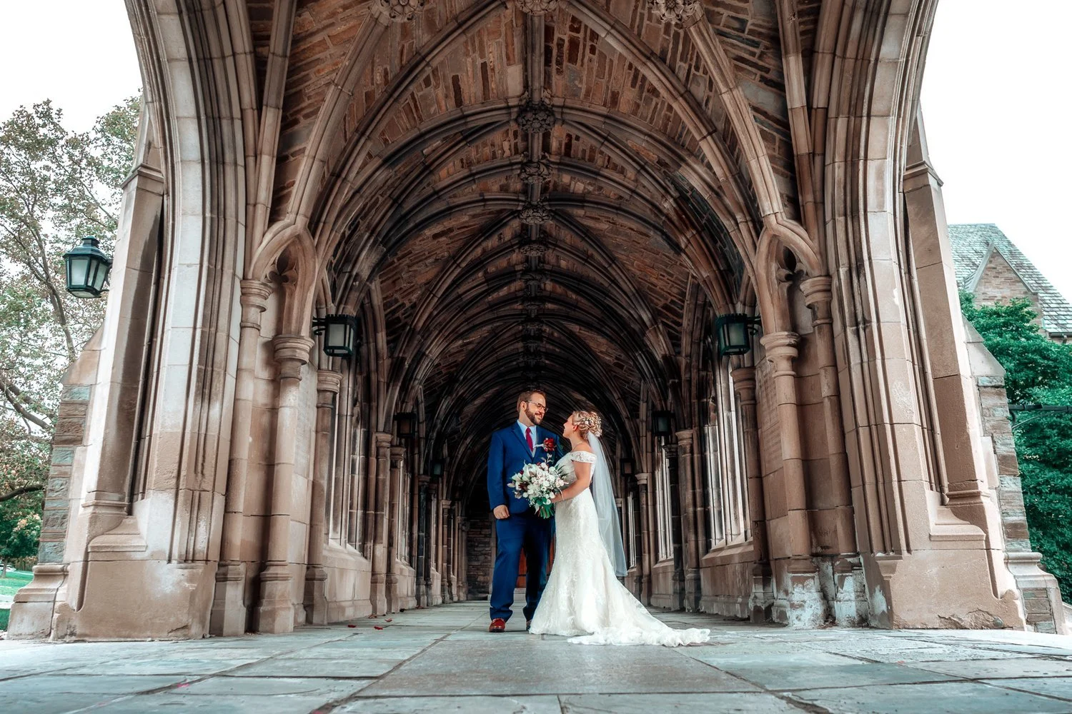 BlackTie Brothers wedding portrait framed by the grand arches of a cathedral