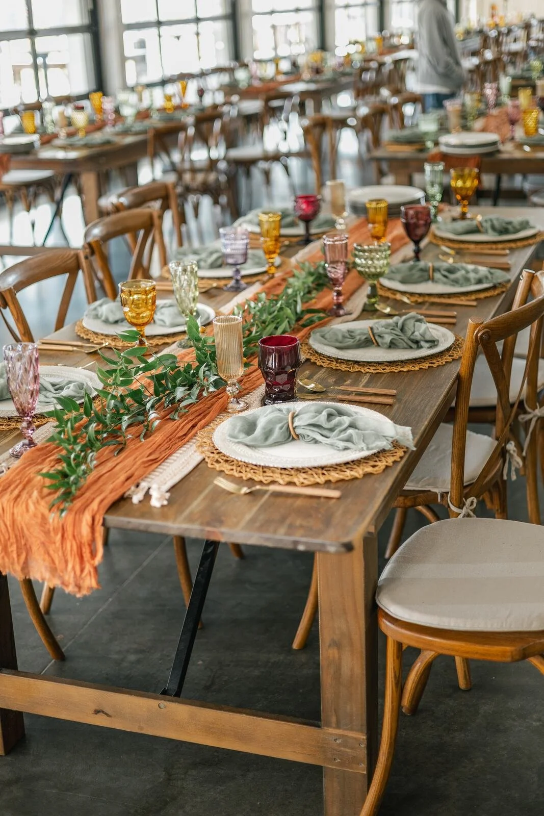 Wedding reception tables arranged inside The Lookout at Hope Lake