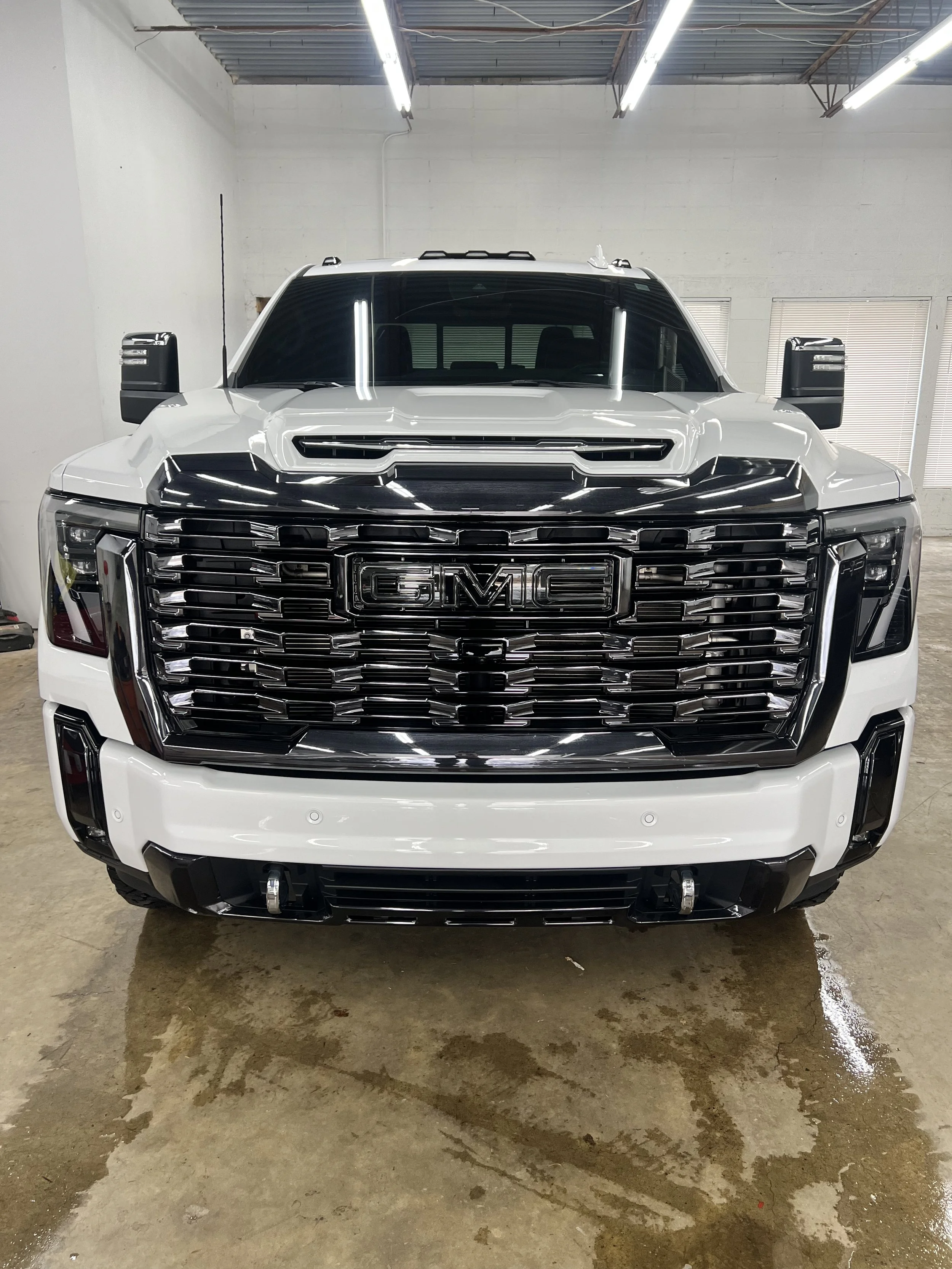 Paint Protection Film PPF installation in Kansas City by Empire Customs Car Detailing applying clear bra for rock chip and scratch protection