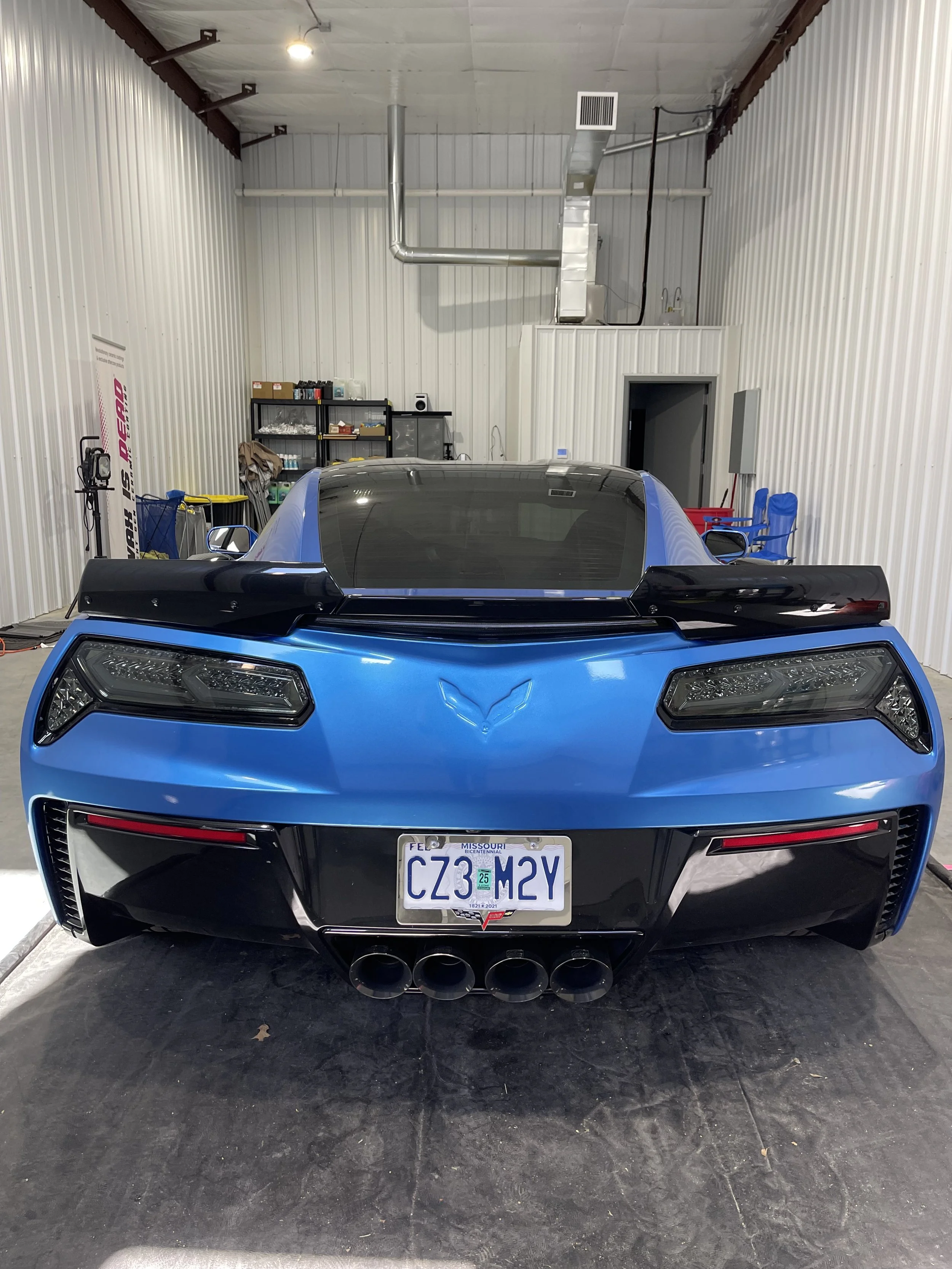 Before and after comparison of vehicle paint showing increased gloss and clarity after a wash and wax.