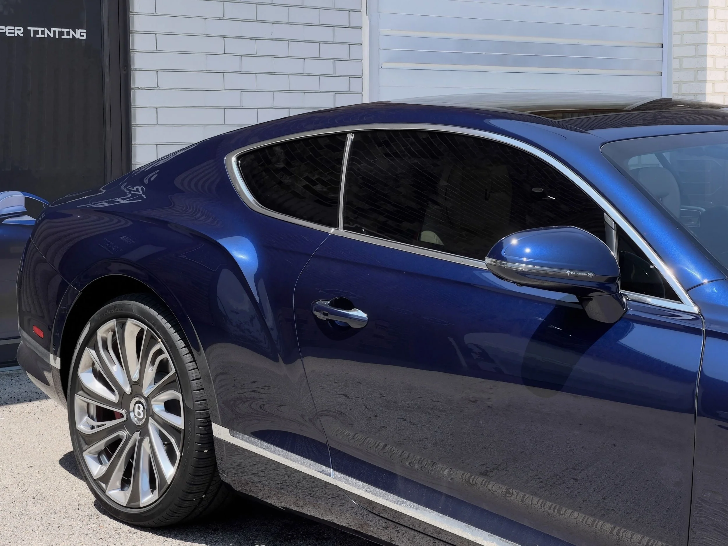 Ceramic window tint installation on Tesla in Kansas City for heat rejection and UV protection.