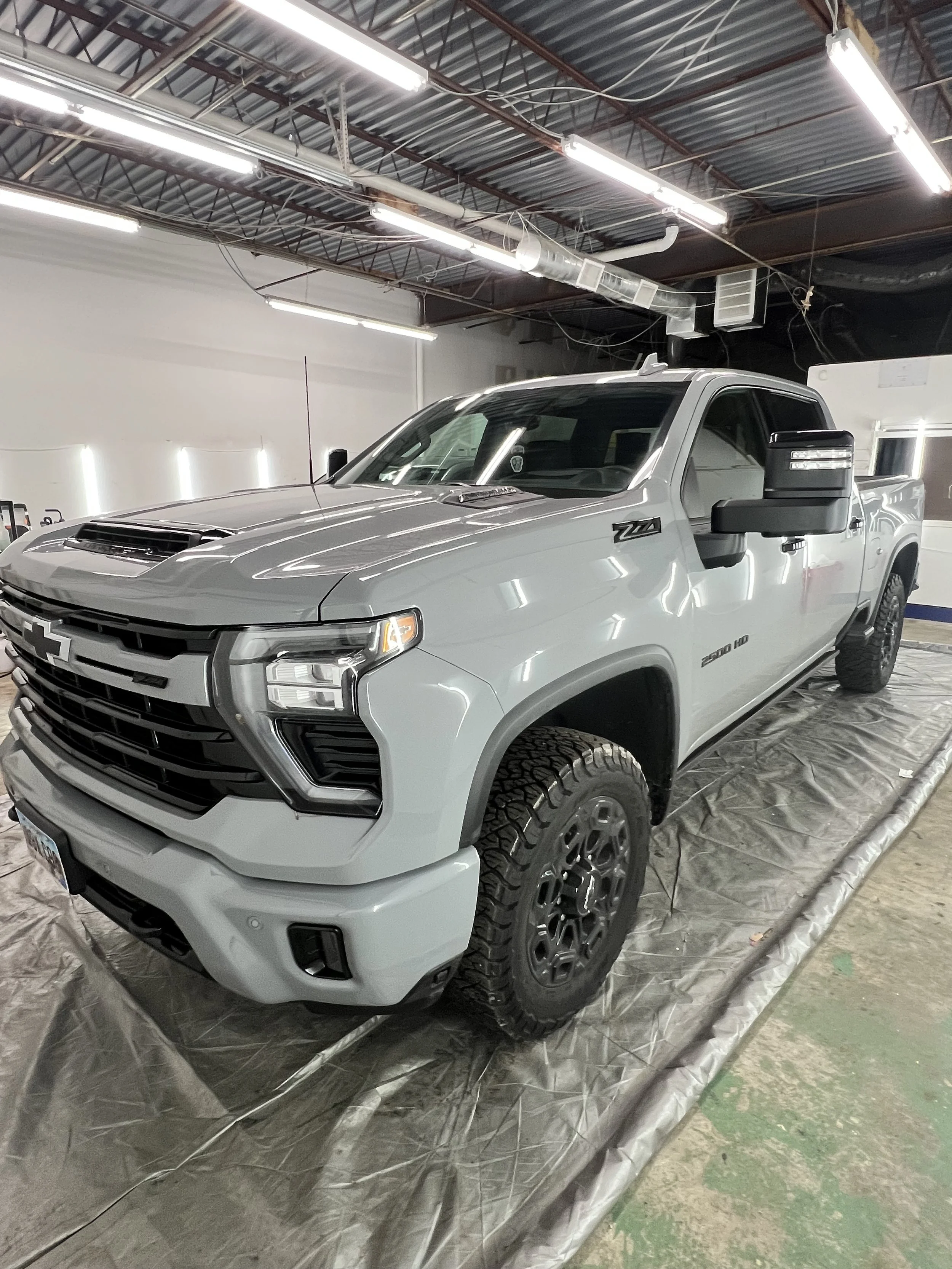 Professional PPF installation on luxury vehicle using precision plotter cut film in Kansas City.