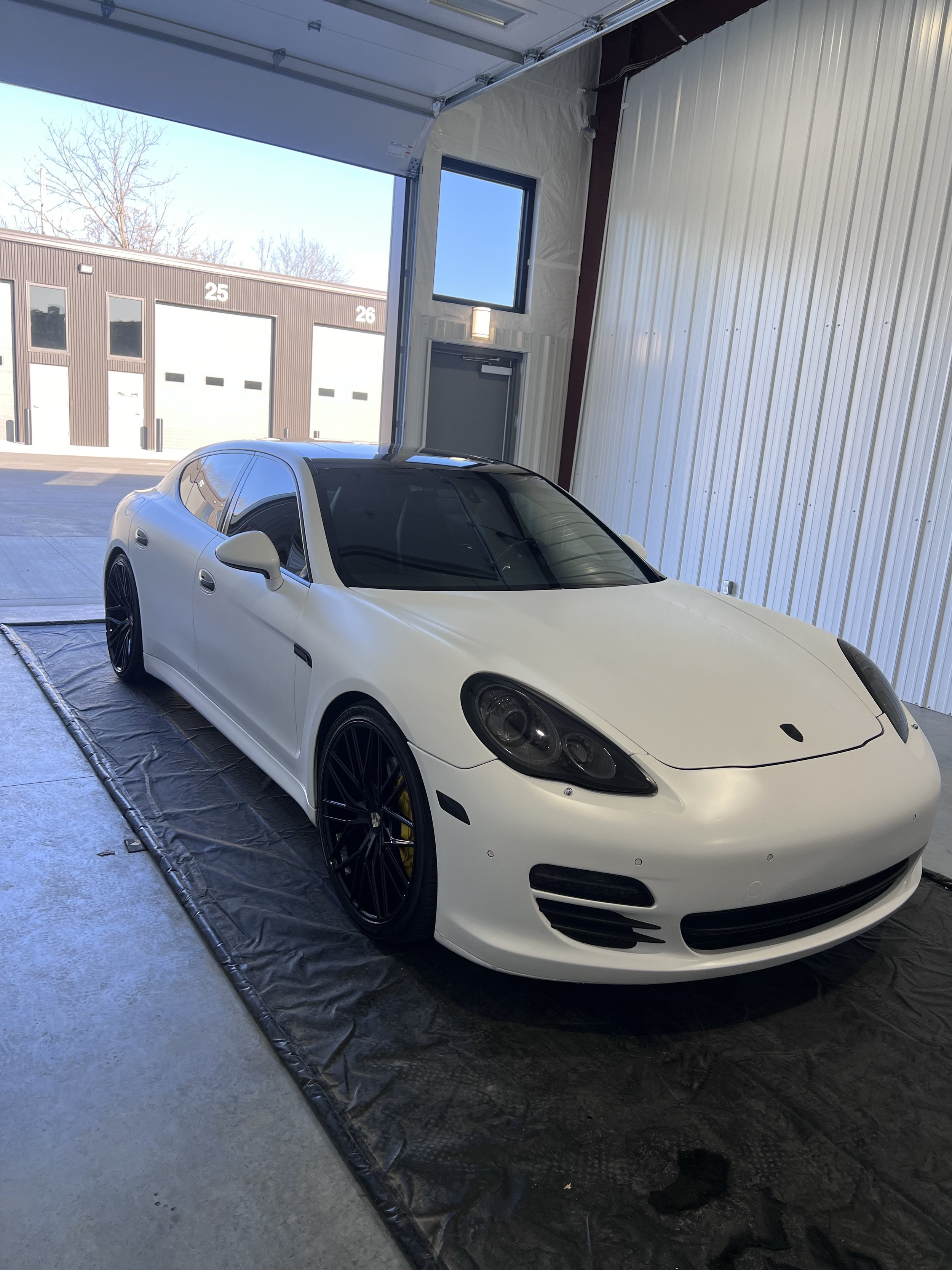 Microfiber towel being used to remove wax and polish the paint to a slick glossy finish.