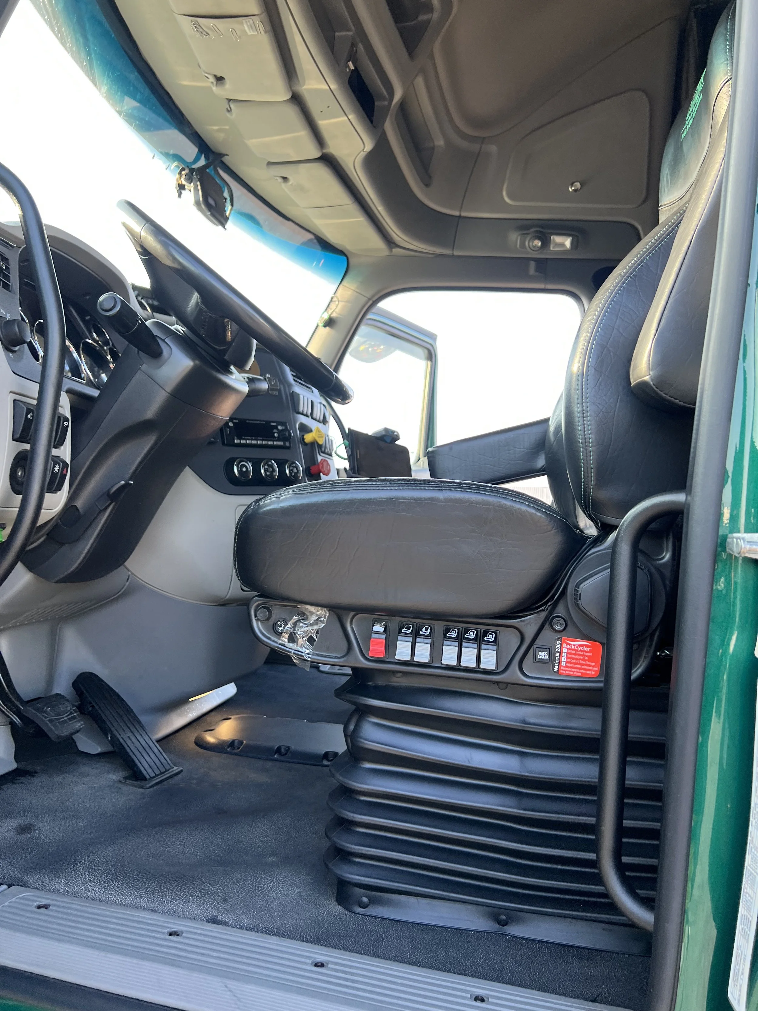 Interior semi truck detailing in Kansas City showing a clean sleeper cab after deep steam cleaning.