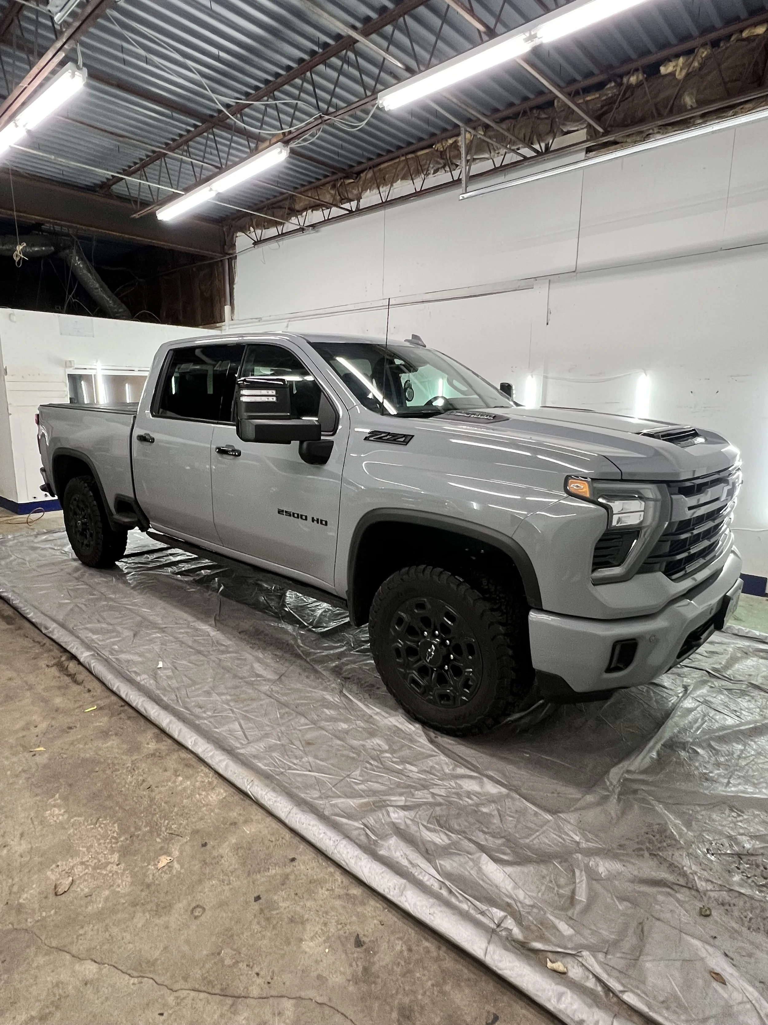 Shiny car exterior after a professional wash and wax service at Empire Customs Car Detailing in Kansas City.