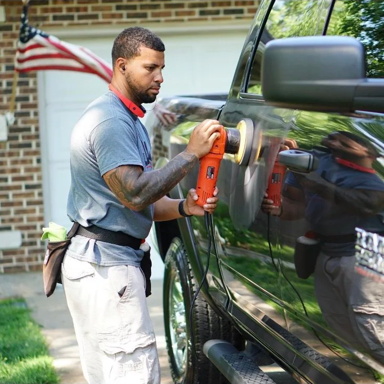Professional paint correction on a car at Empire Customs Car Detailing in Kansas City restoring gloss by removing swirl marks scratches and oxidation from the paint surface.