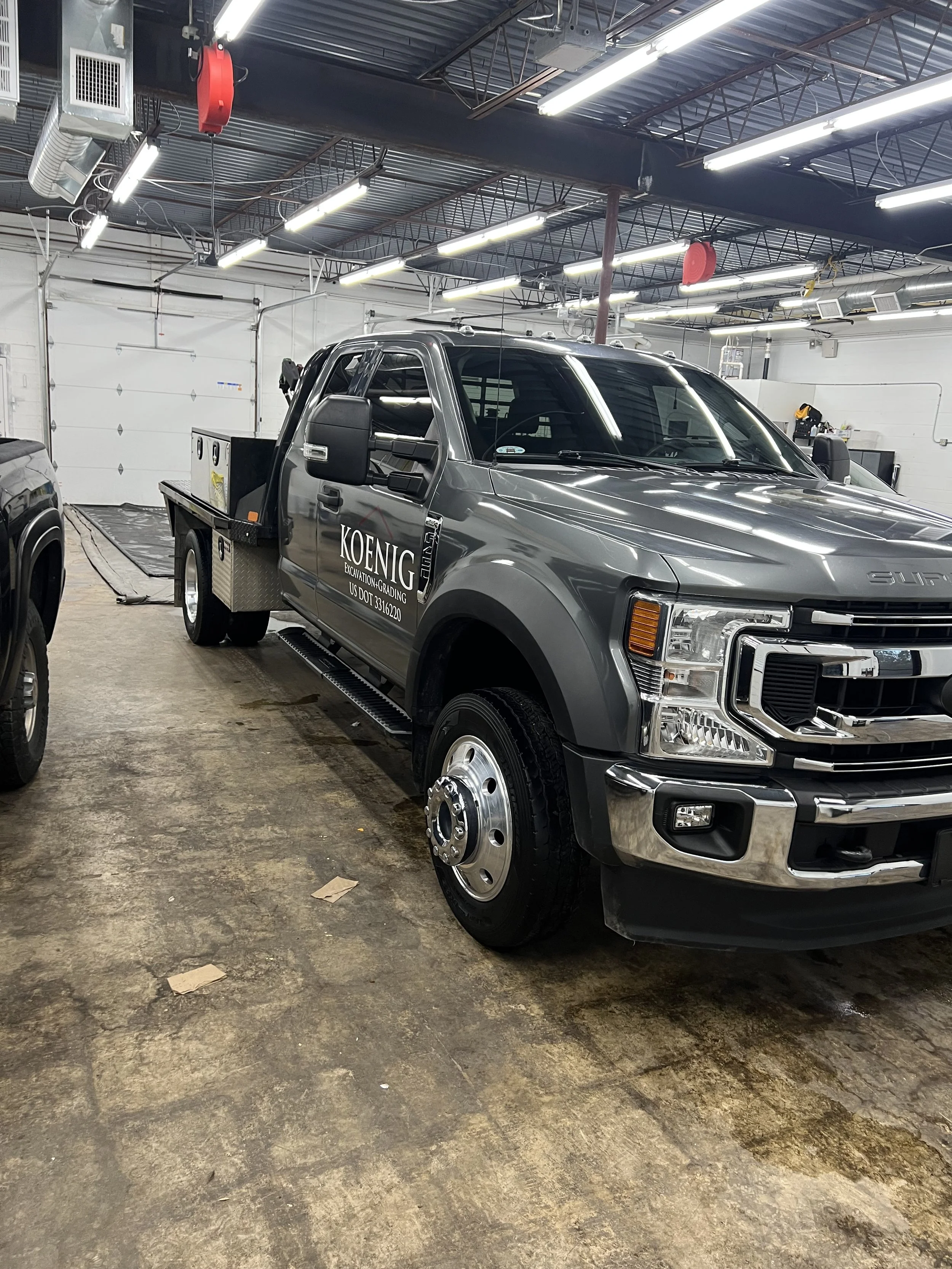 Wax being applied to a car’s paint by hand to increase gloss and add protective shine.