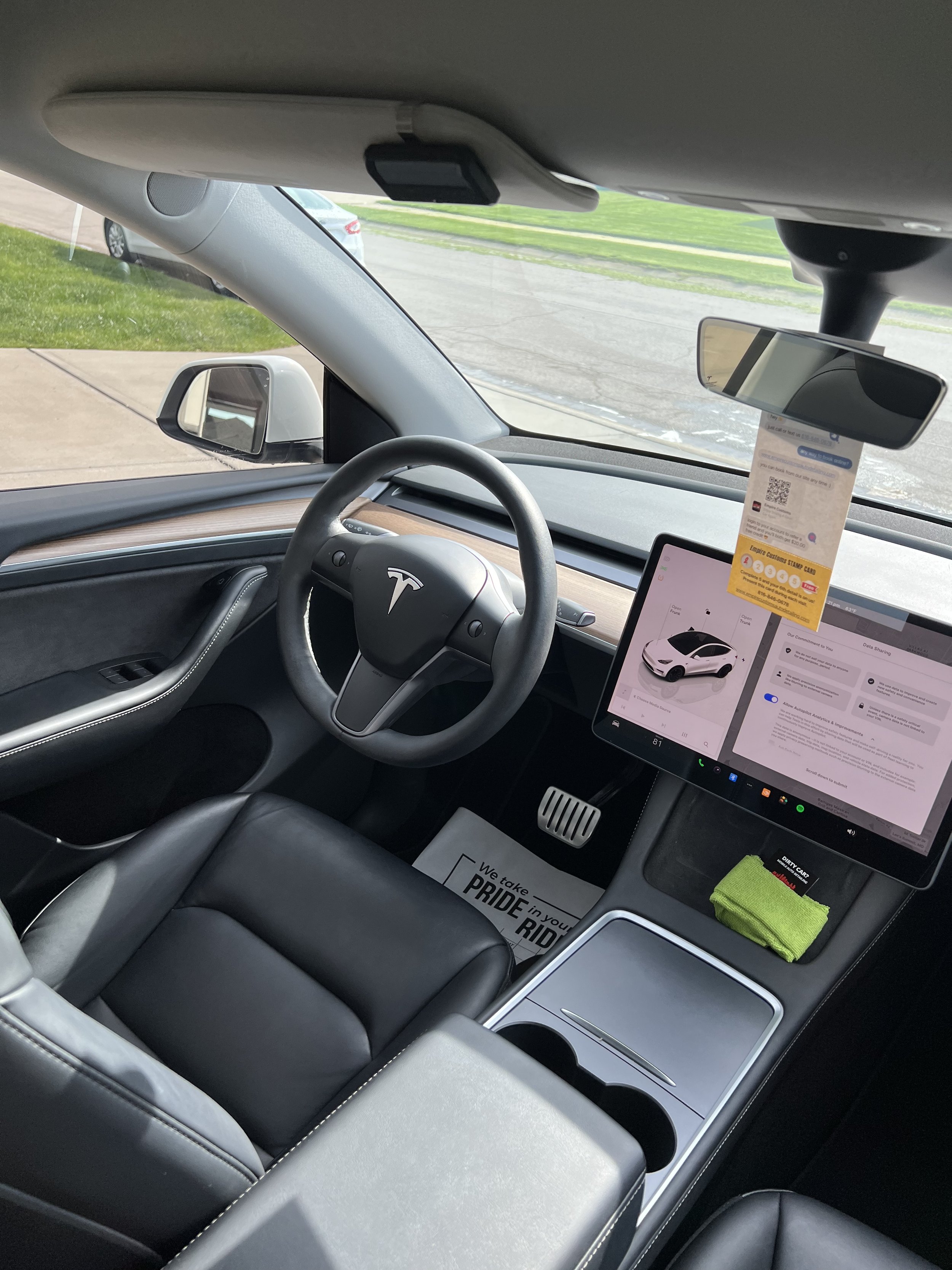 Empire Customs Car Detailing Ceramic Coating & PPF specialist deep cleaning and detailing a car interior in Kansas City, restoring leather, carpets, and dashboard to like-new condition.