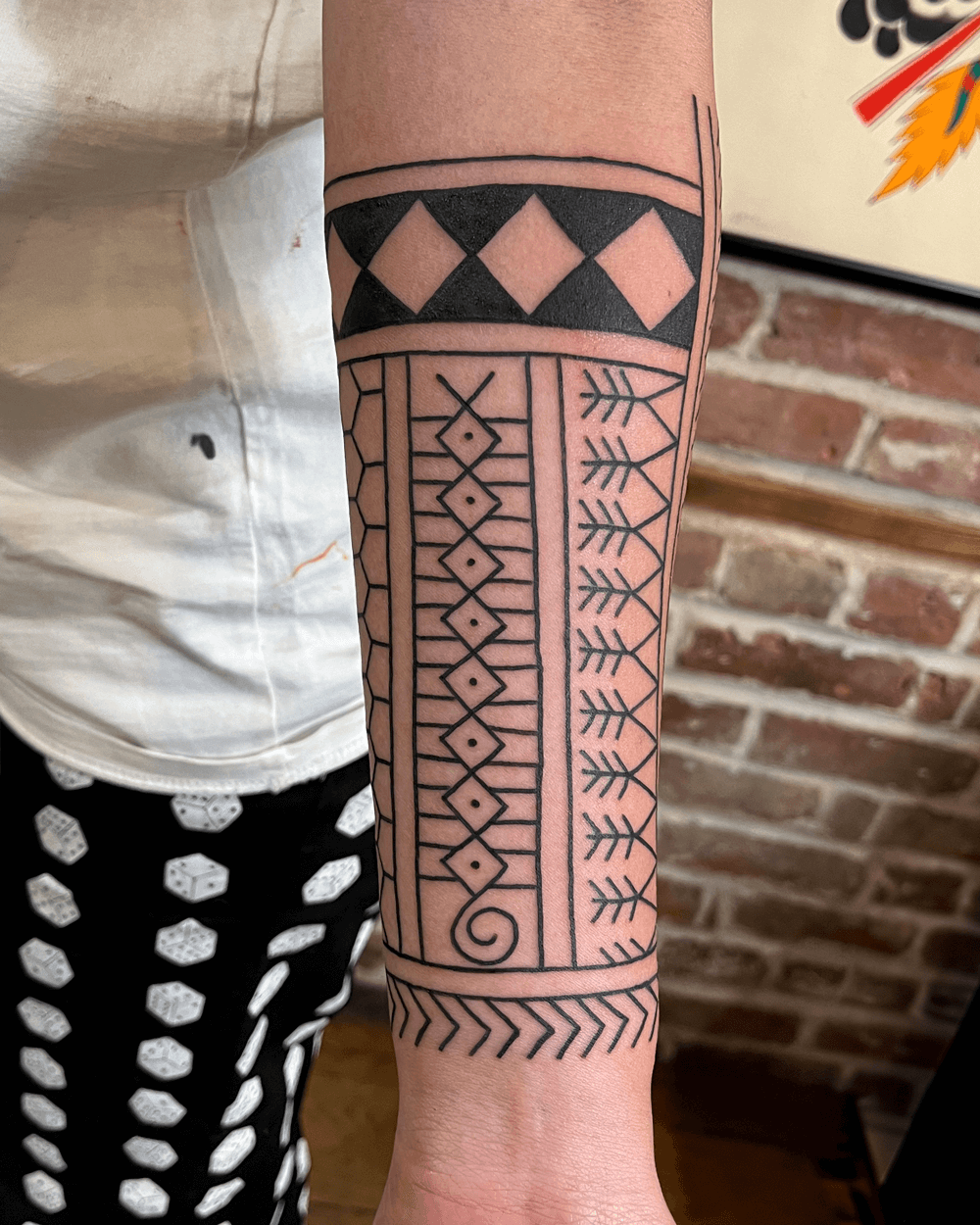 Traditional Filipino pattern half sleeve on lower arm of client