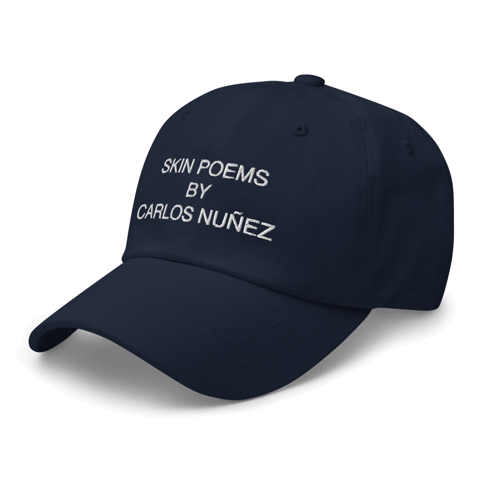 Navy hat designed by artist Carlos Nunez.