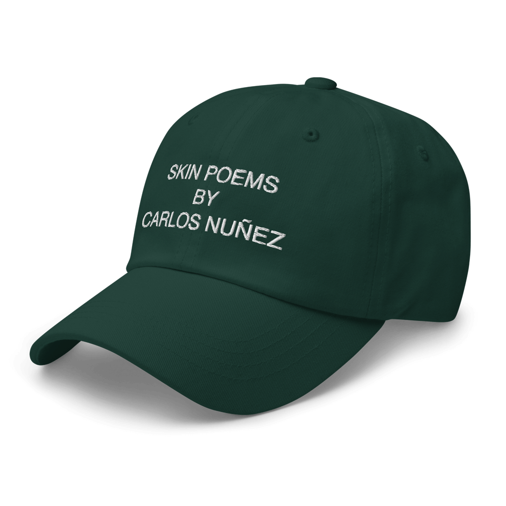 Spruce color hat with Skin Poem embroidery by Carlos Nunez.
