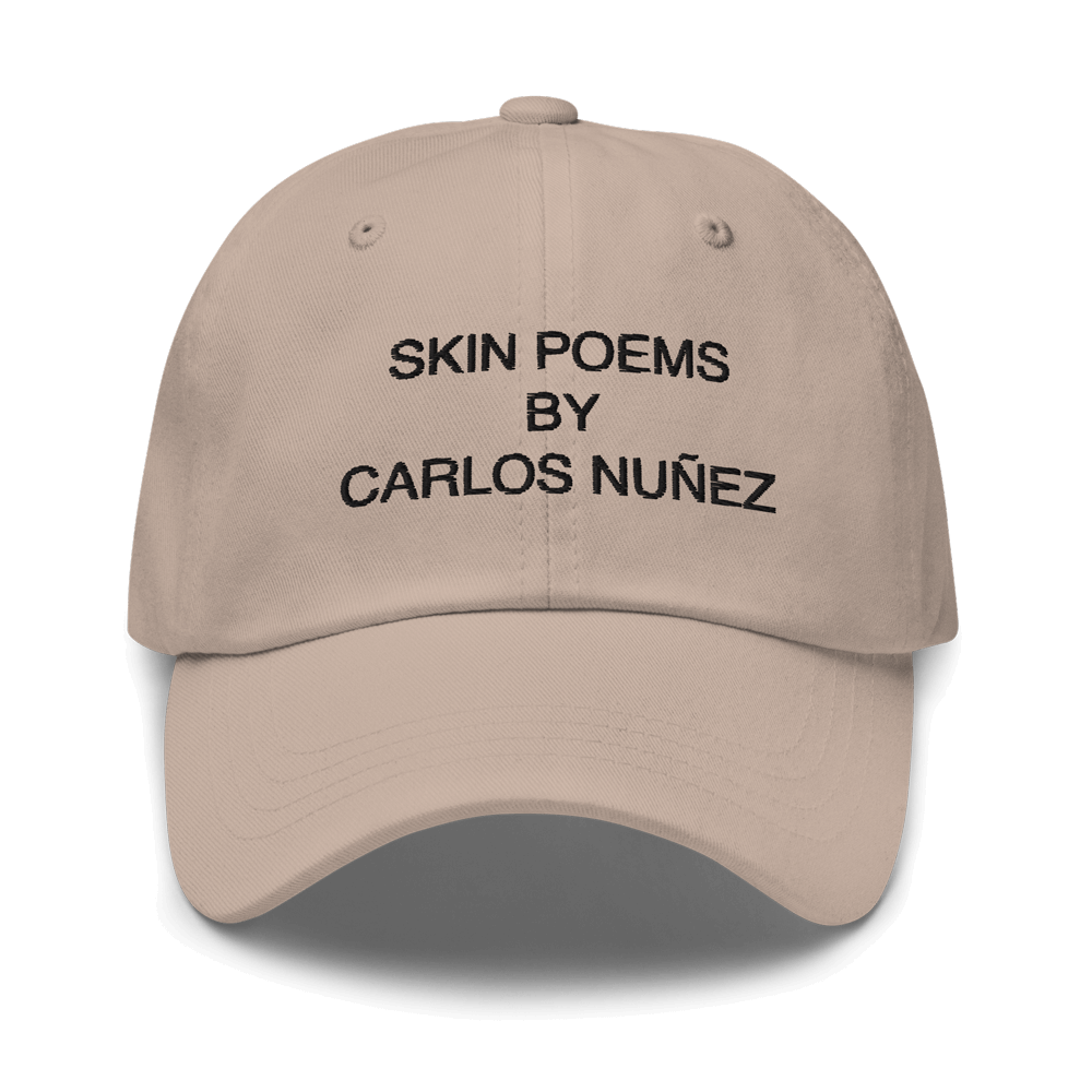 Classic dad hat with embroidery quote by tattoo artist Carlos Nunez.